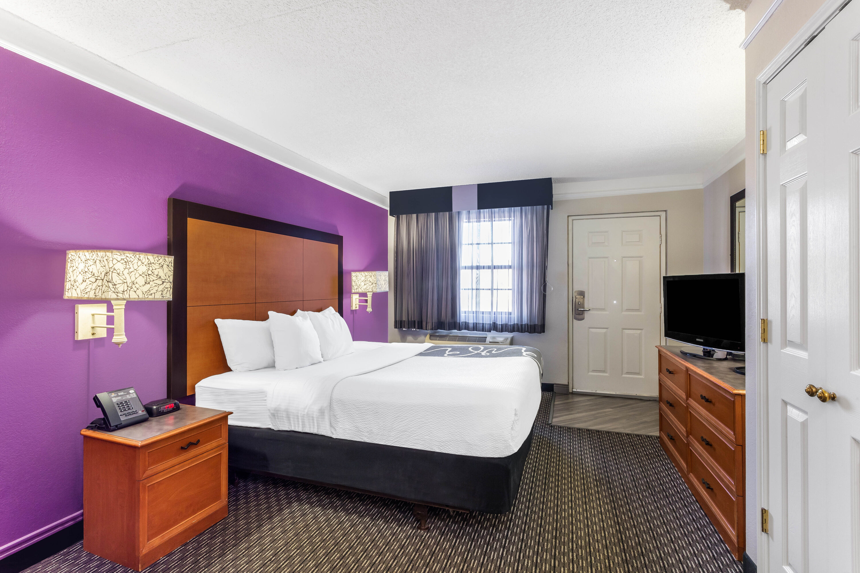 Guest room at the La Quinta Inn by Wyndham Odessa in Odessa, Texas