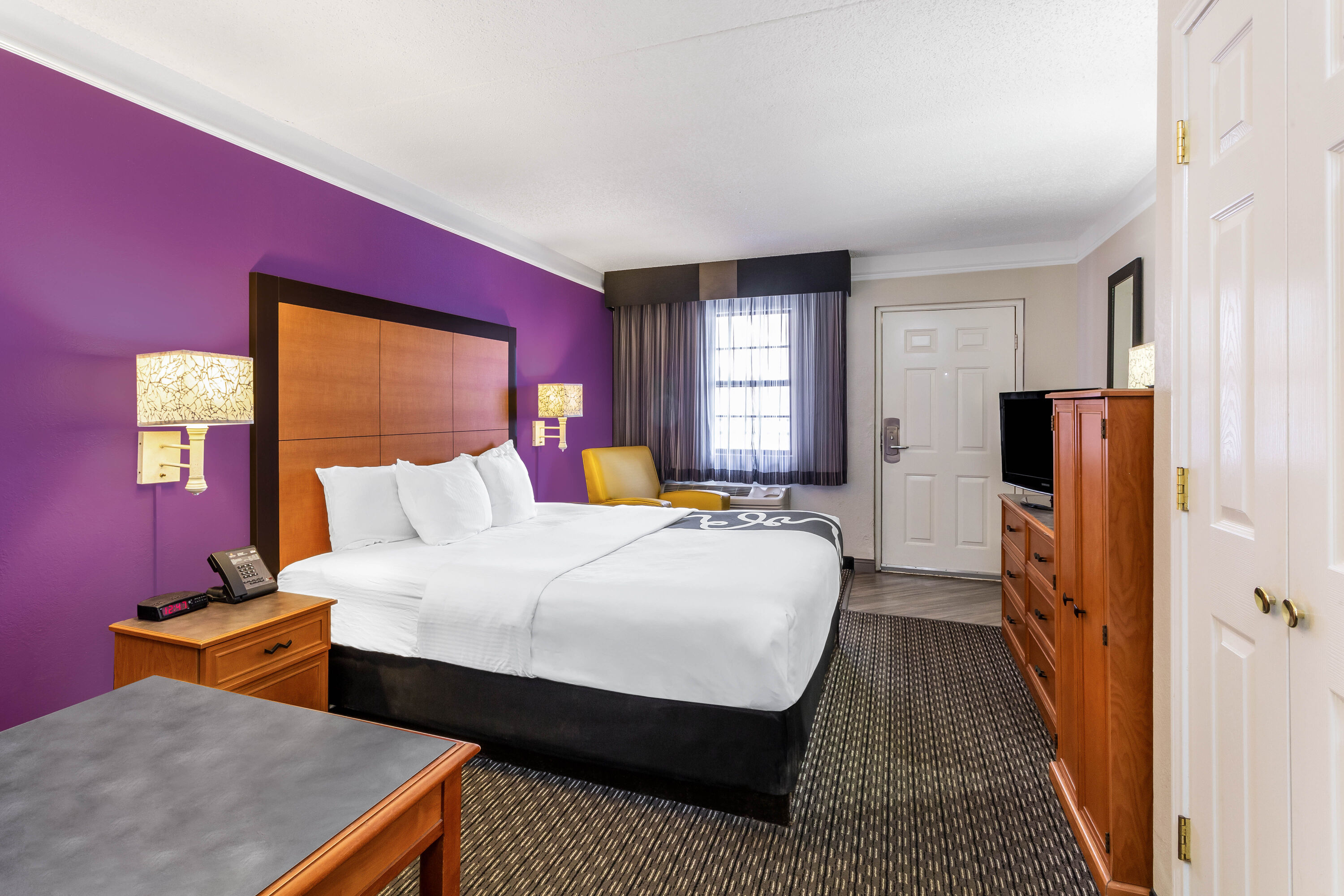 Guest room at the La Quinta Inn by Wyndham Odessa in Odessa, Texas