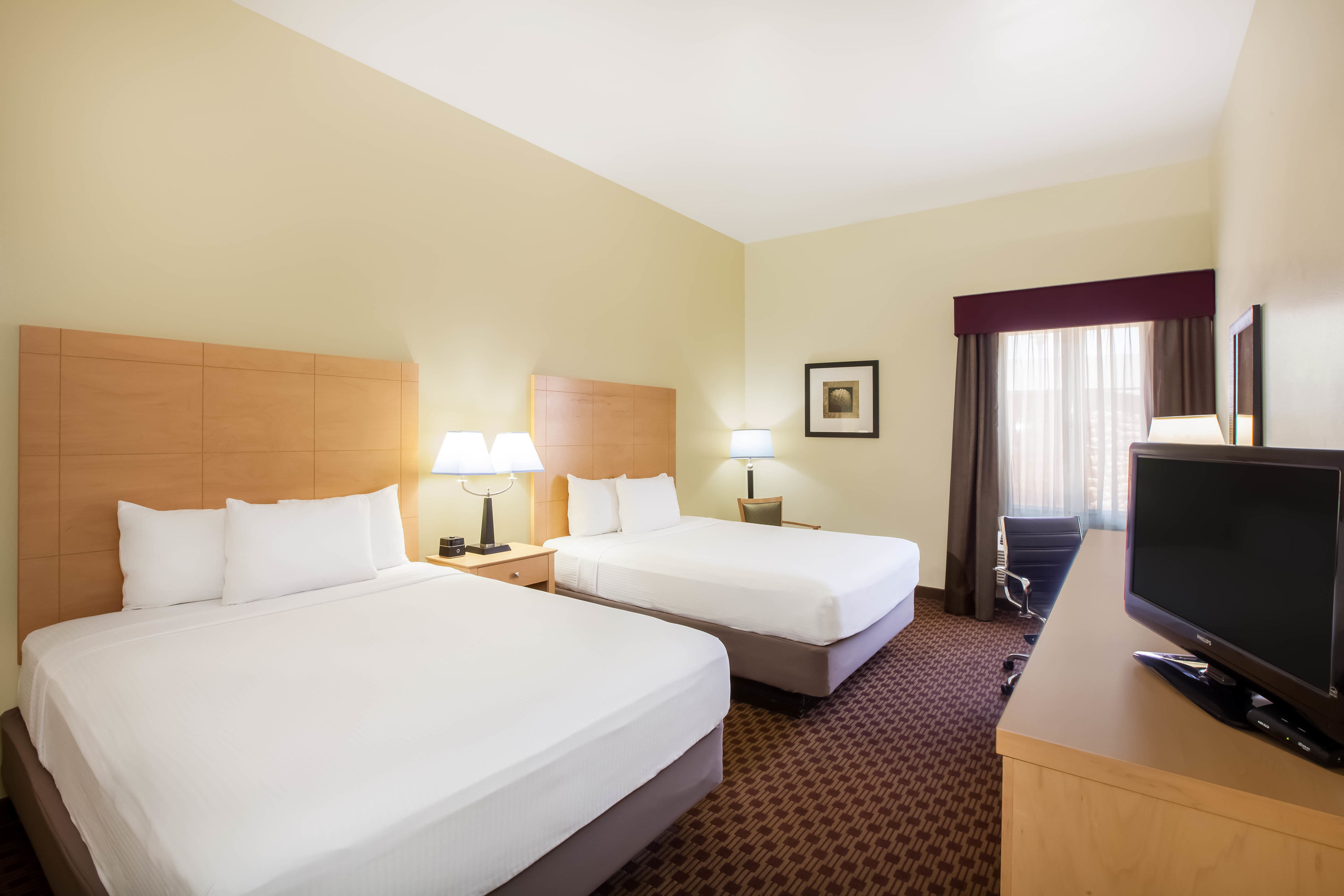 Guest room at the La Quinta Inn & Suites by Wyndham Odessa North in Odessa, Texas
