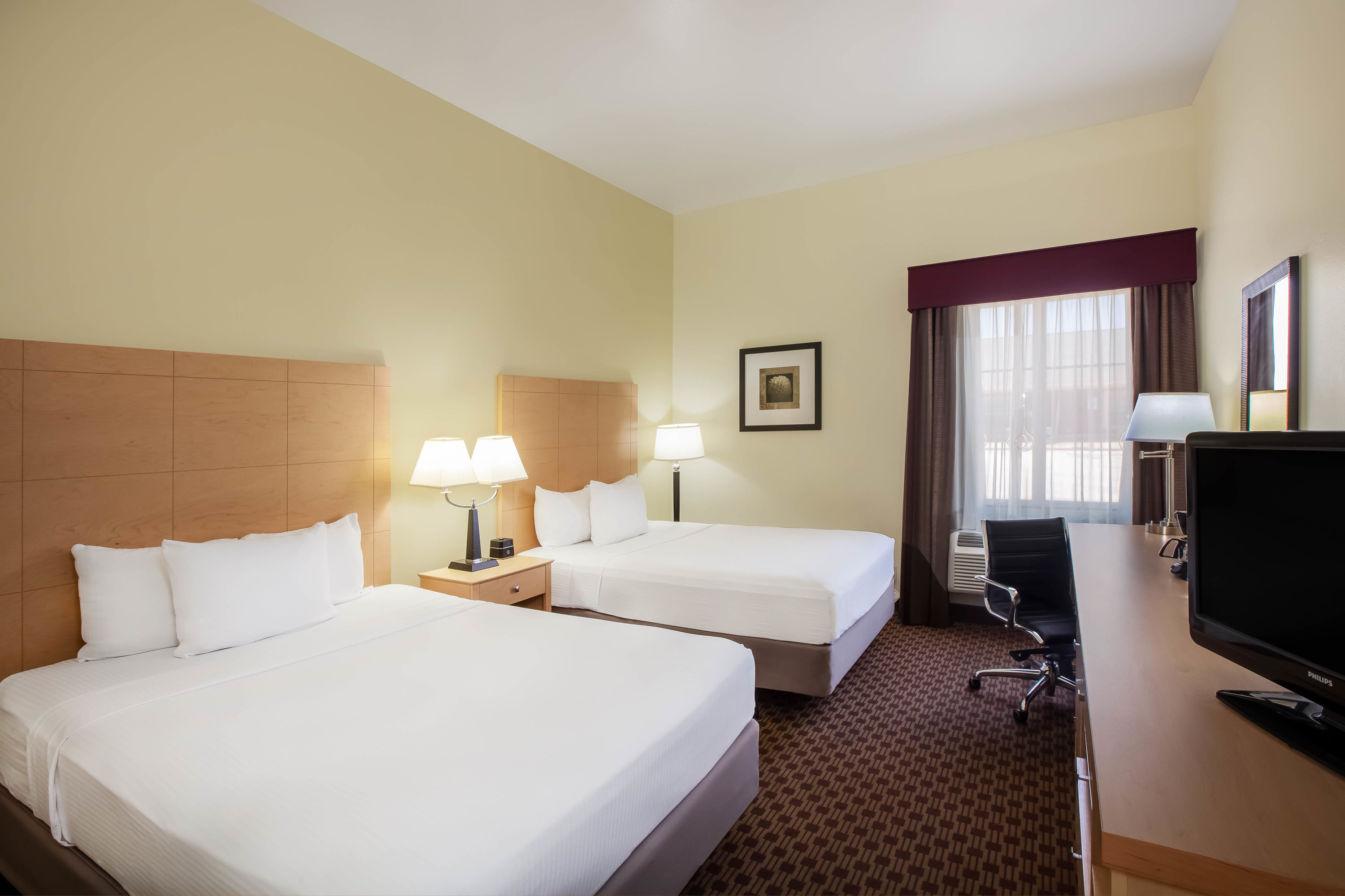 Guest room at the La Quinta Inn & Suites by Wyndham Odessa North in Odessa, Texas