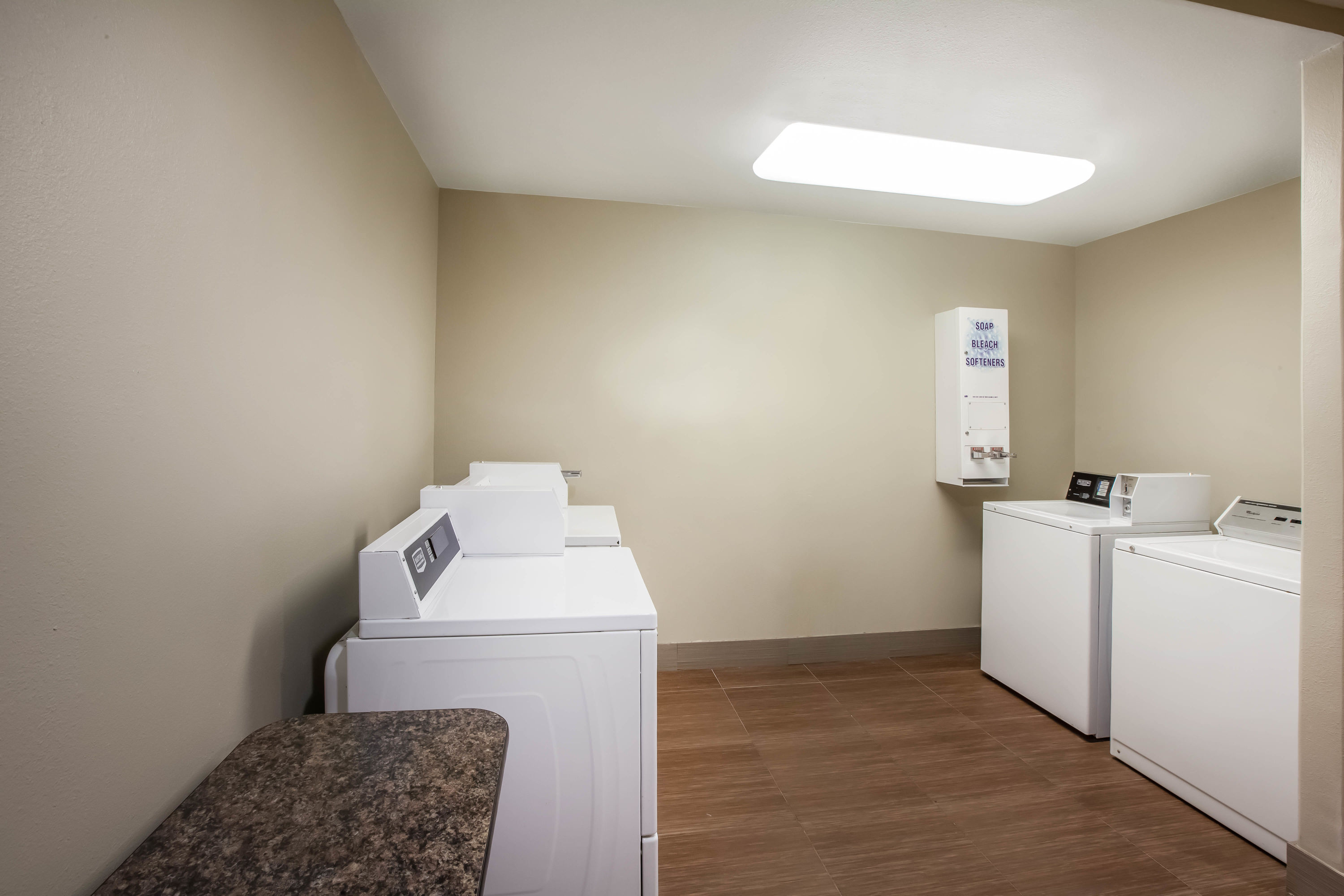 Laundry facilities at La Quinta Inn & Suites by Wyndham Odessa North in Odessa, Texas