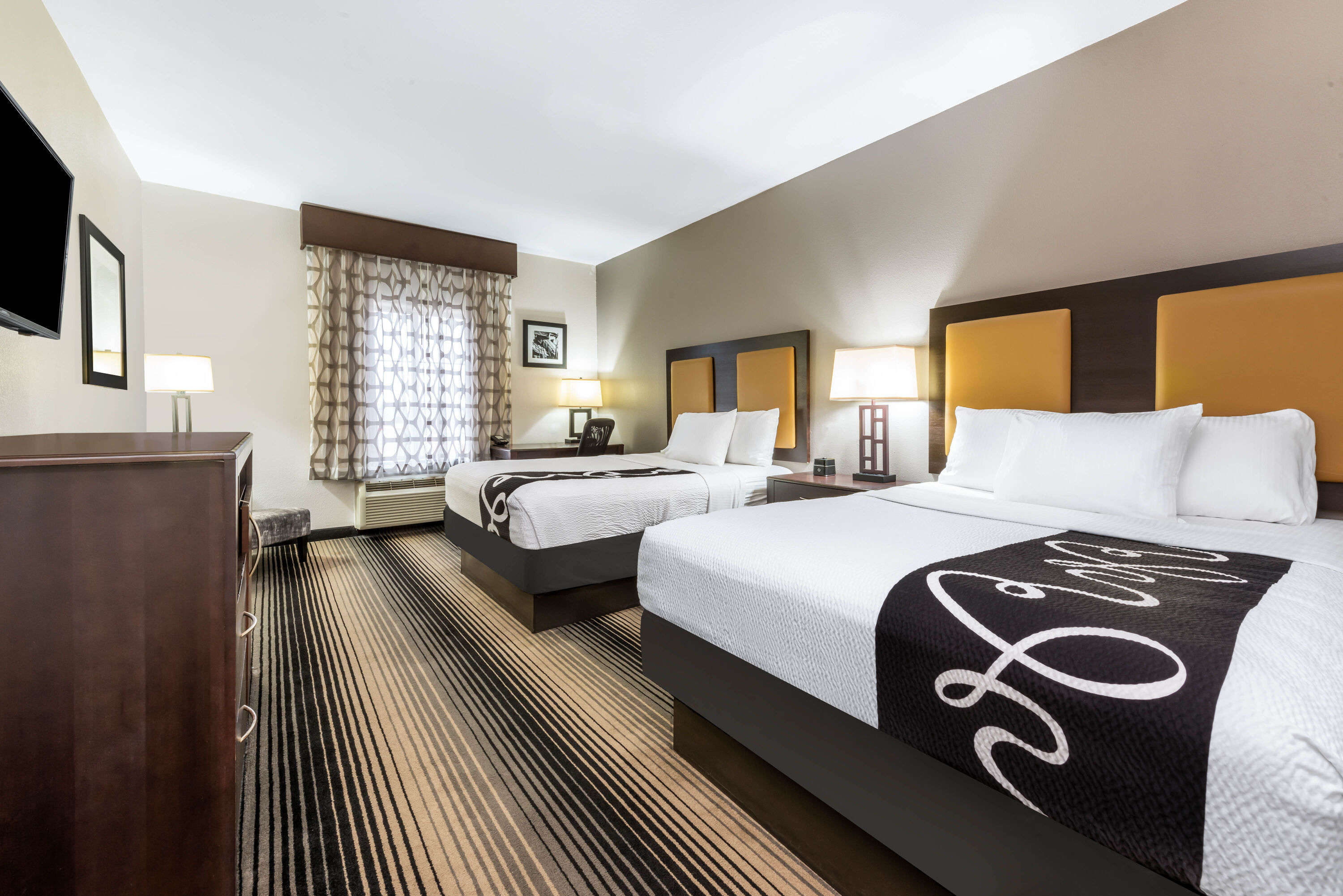 Guest room at the La Quinta Inn & Suites by Wyndham Orange in Orange, Texas