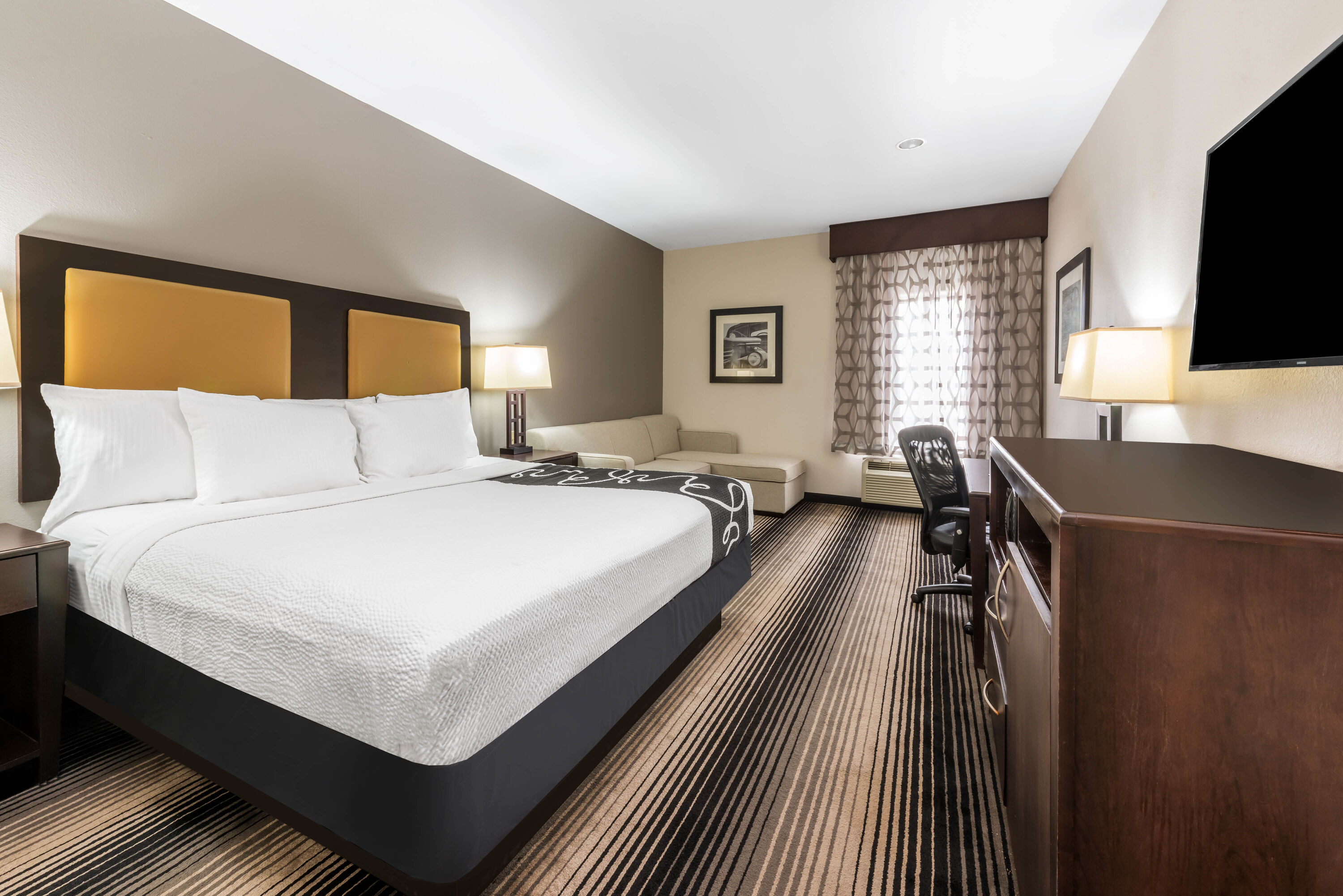 Guest room at the La Quinta Inn & Suites by Wyndham Orange in Orange, Texas