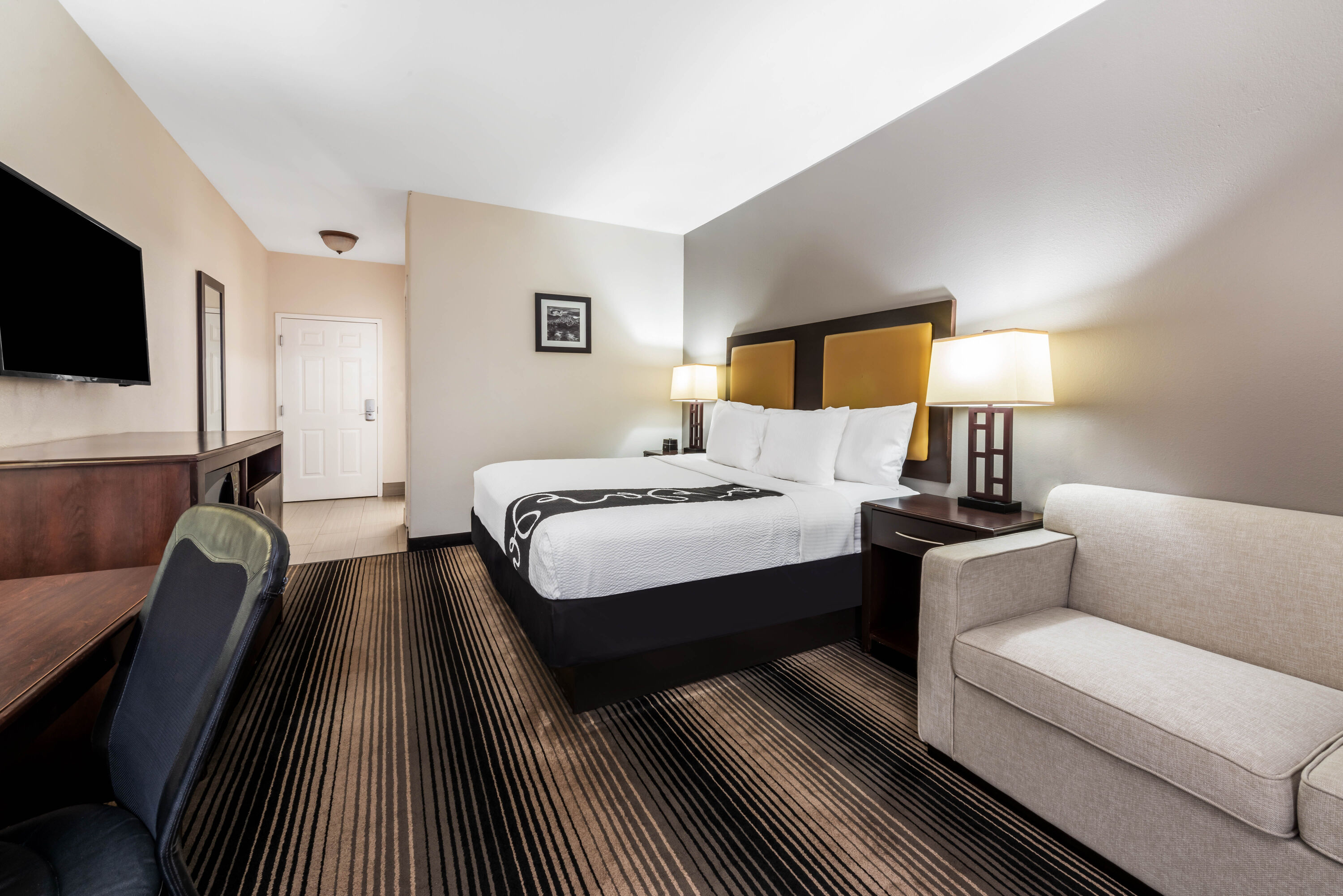 Guest room at the La Quinta Inn & Suites by Wyndham Orange in Orange, Texas