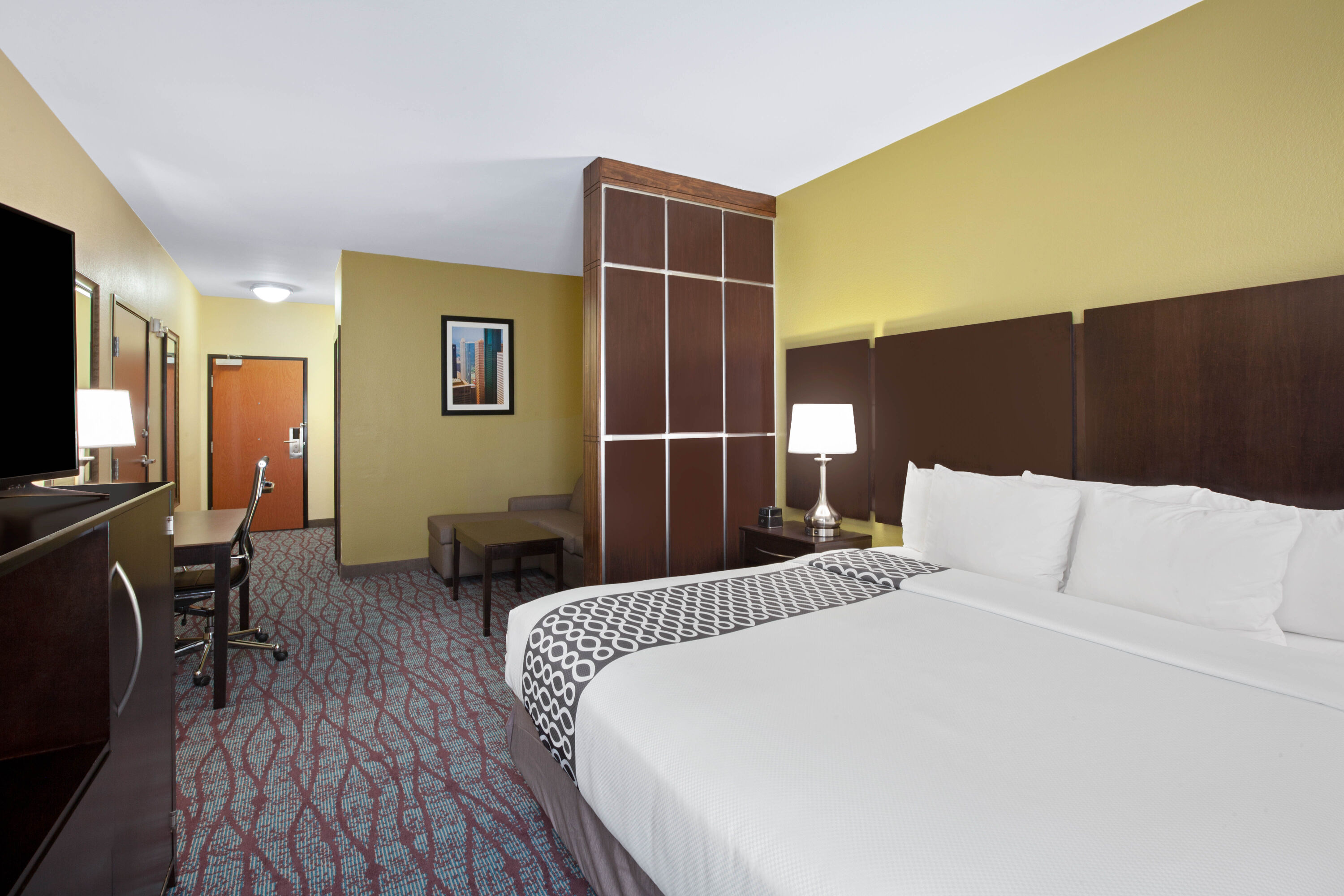 Guest room at the La Quinta Inn & Suites by Wyndham Pasadena North in Pasadena, Texas