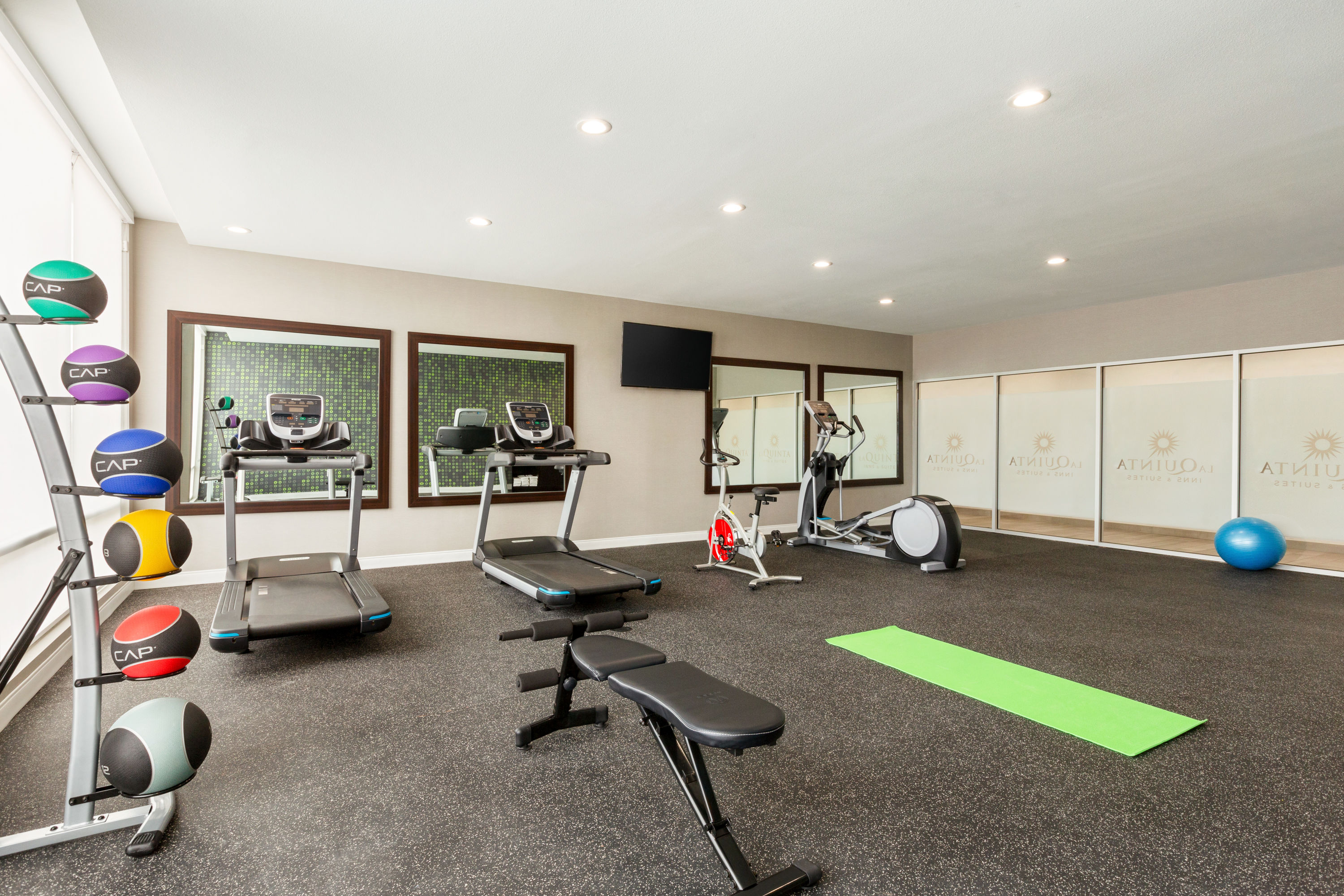 Fitness room at La Quinta Inn & Suites by Wyndham Richmond-Sugarland in Richmond, Texas