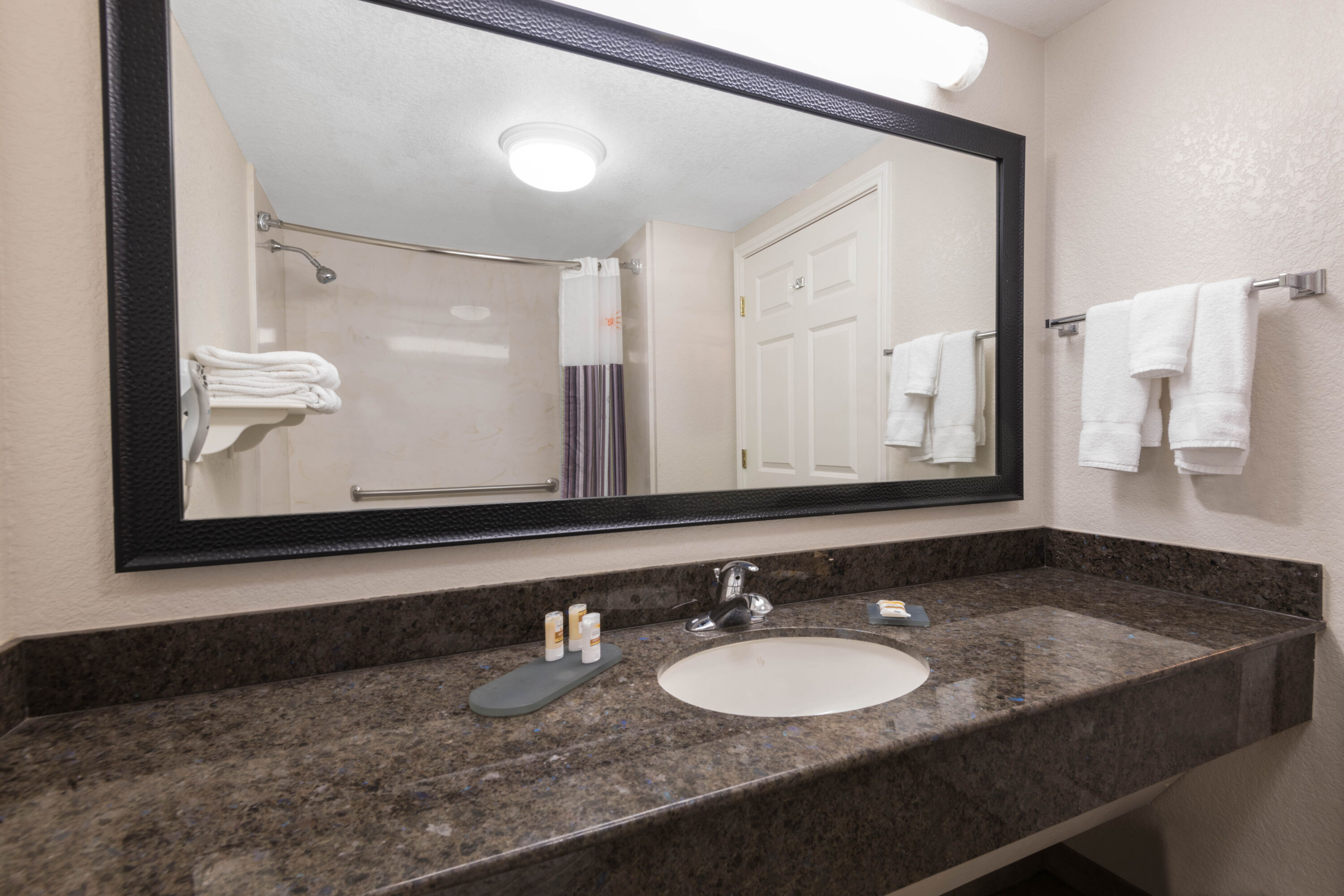 Guest room bath at the La Quinta Inn & Suites by Wyndham San Antonio Riverwalk in San Antonio, Texas