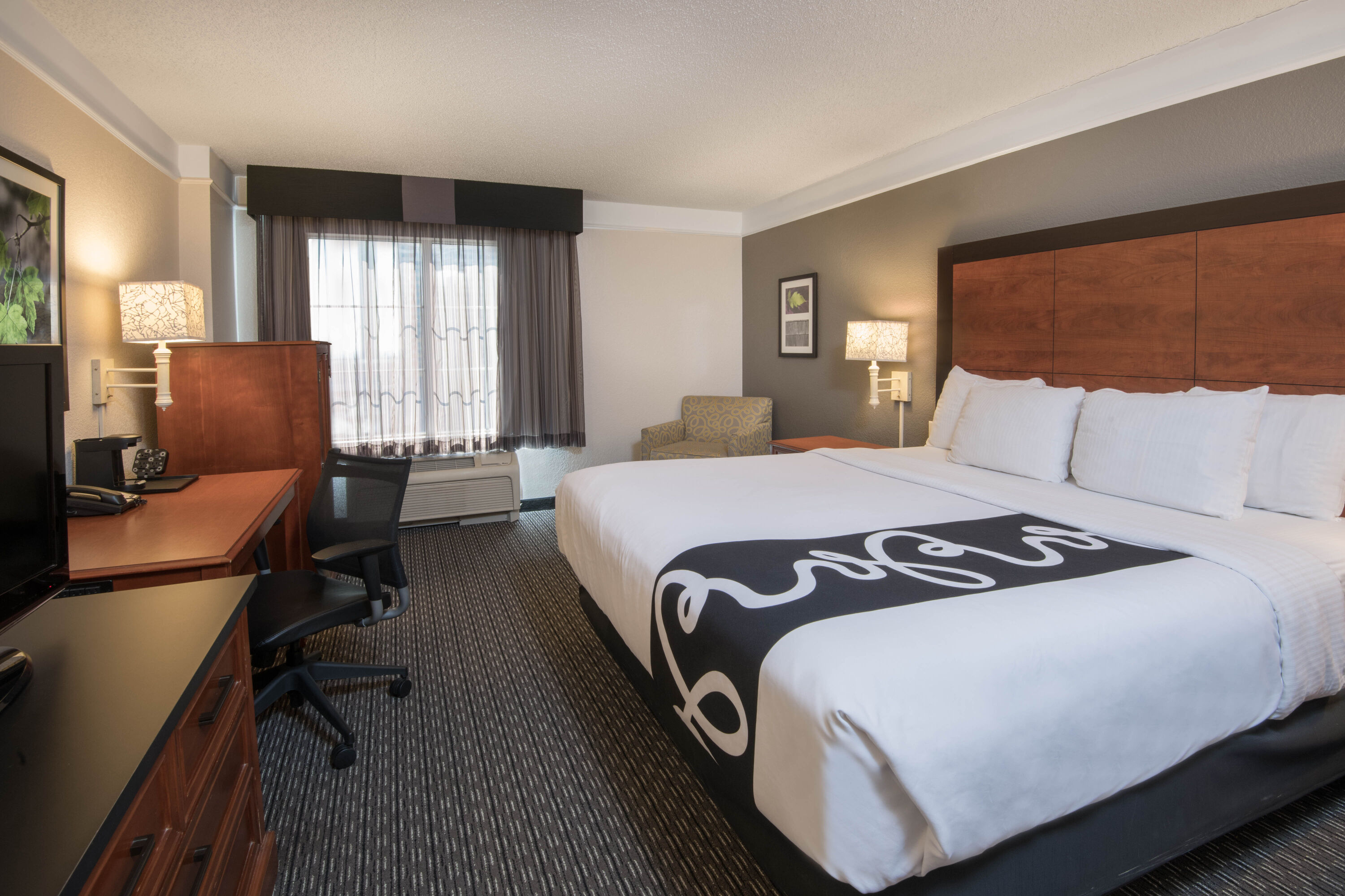 Guest room at the La Quinta Inn & Suites by Wyndham San Antonio Riverwalk in San Antonio, Texas