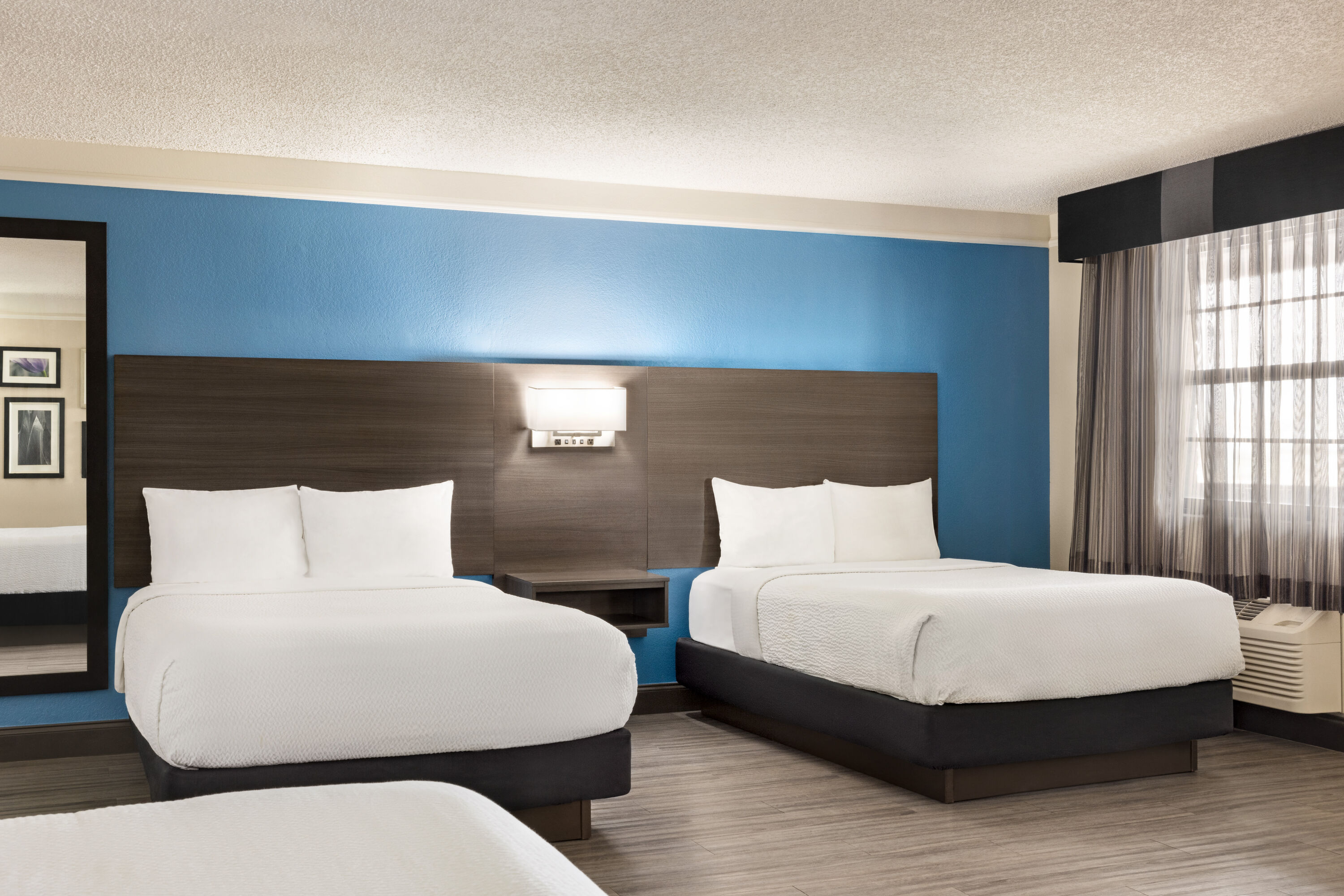 Guest room at the La Quinta Inn by Wyndham San Antonio I-35 N at Toepperwein in San Antonio, Texas
