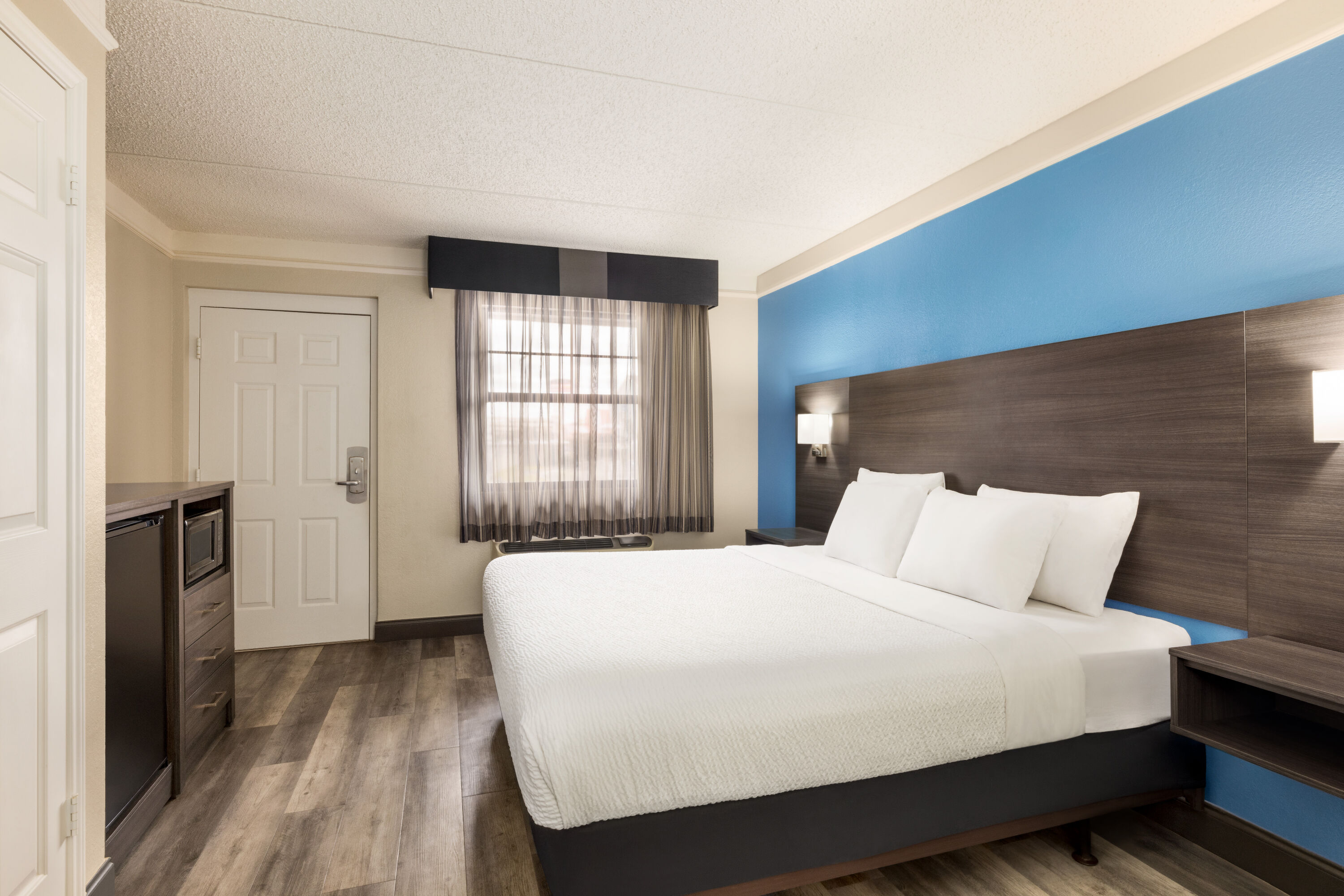 Guest room at the La Quinta Inn by Wyndham San Antonio I-35 N at Toepperwein in San Antonio, Texas