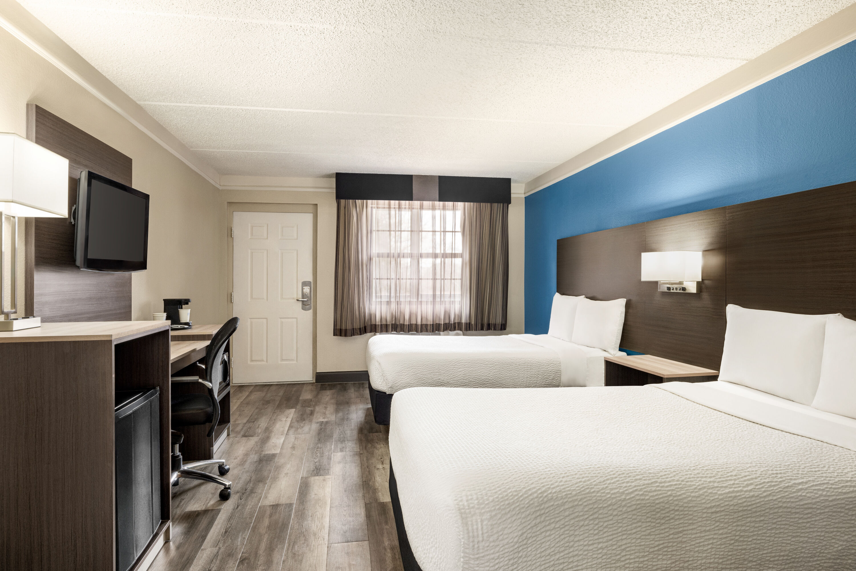 Guest room at the La Quinta Inn by Wyndham San Antonio I-35 N at Toepperwein in San Antonio, Texas