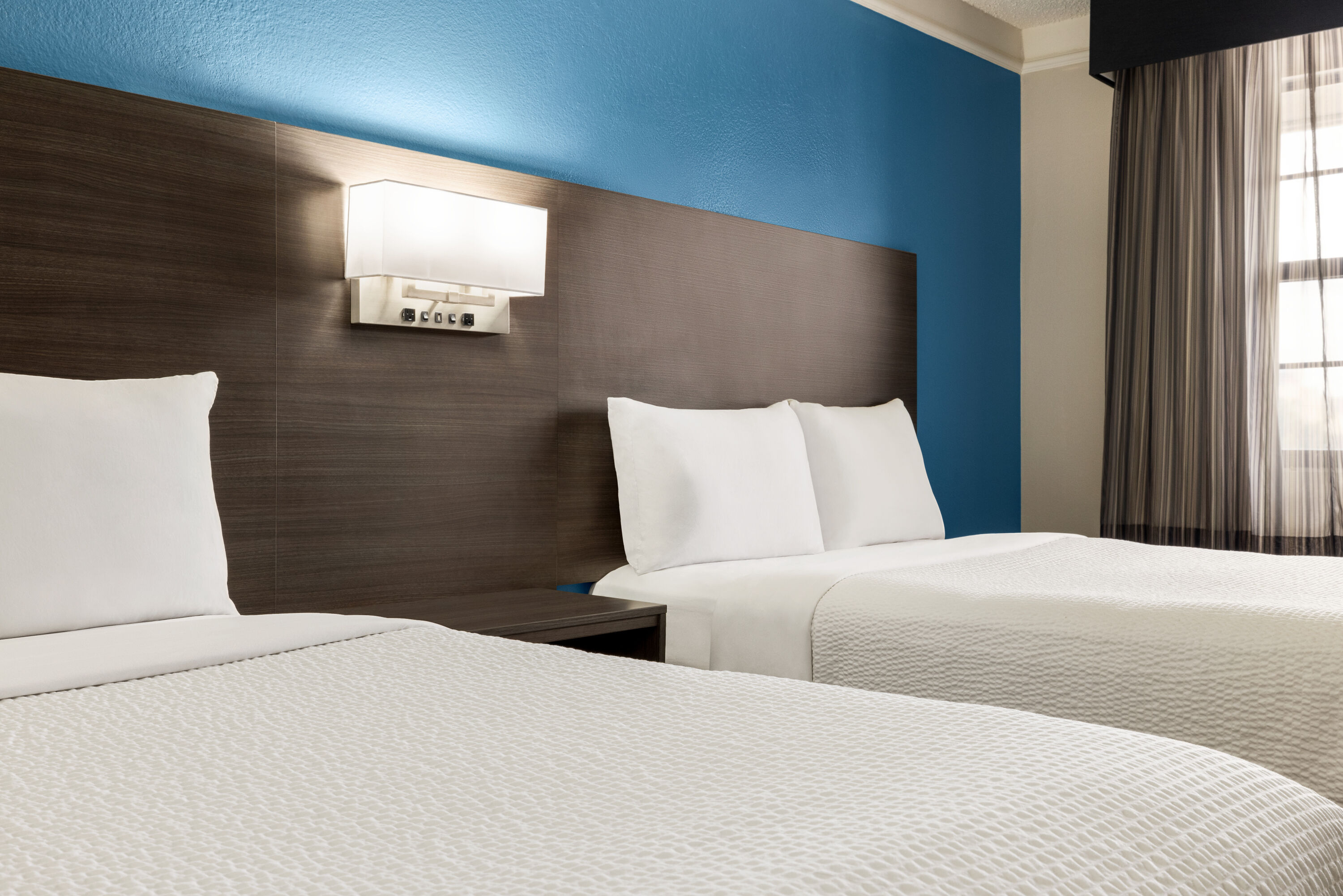 Guest room at the La Quinta Inn by Wyndham San Antonio I-35 N at Toepperwein in San Antonio, Texas