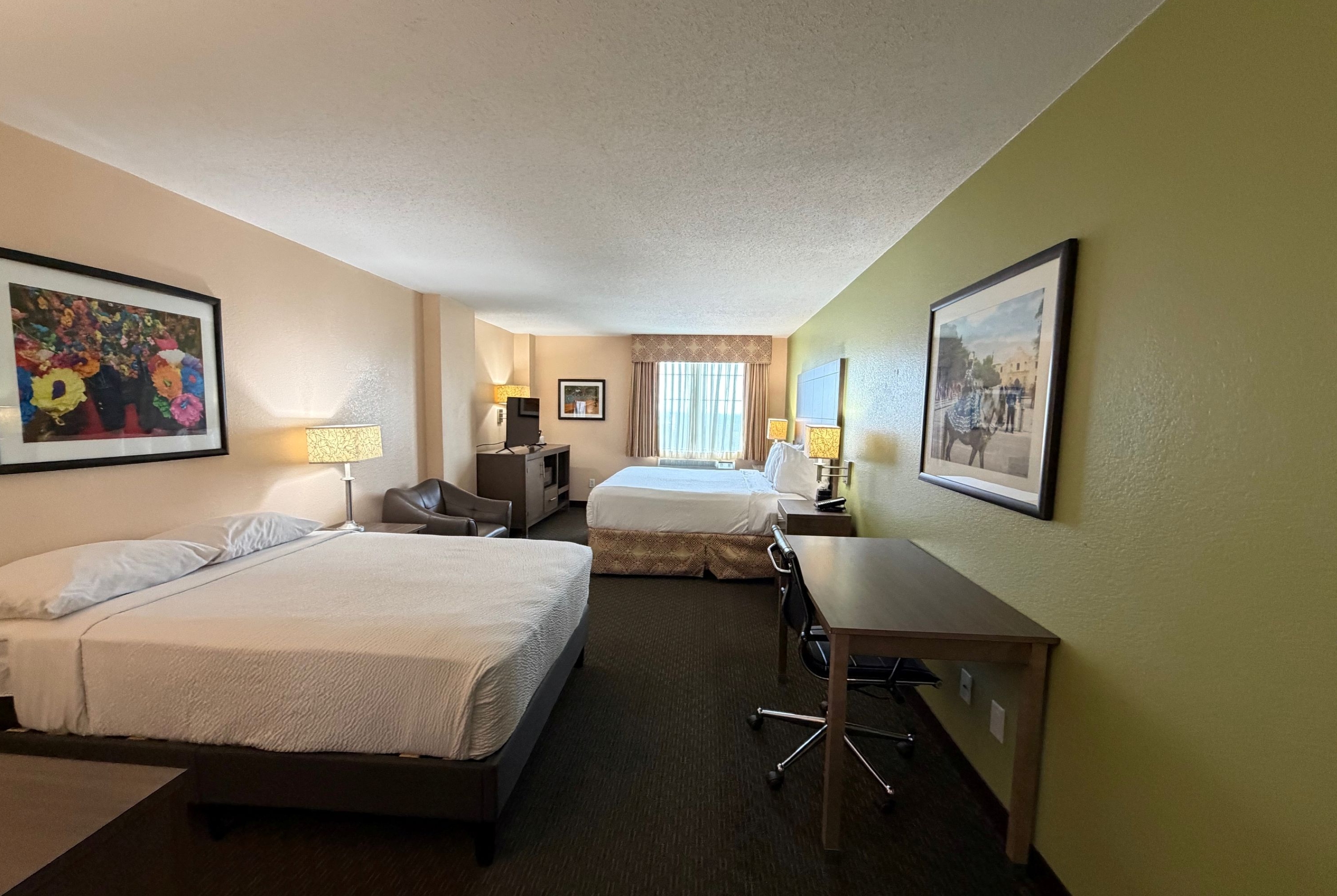 King bed guest room at the La Quinta Inn & Suites by Wyndham San Antonio Medical Ctr NW in San Antonio, Texas