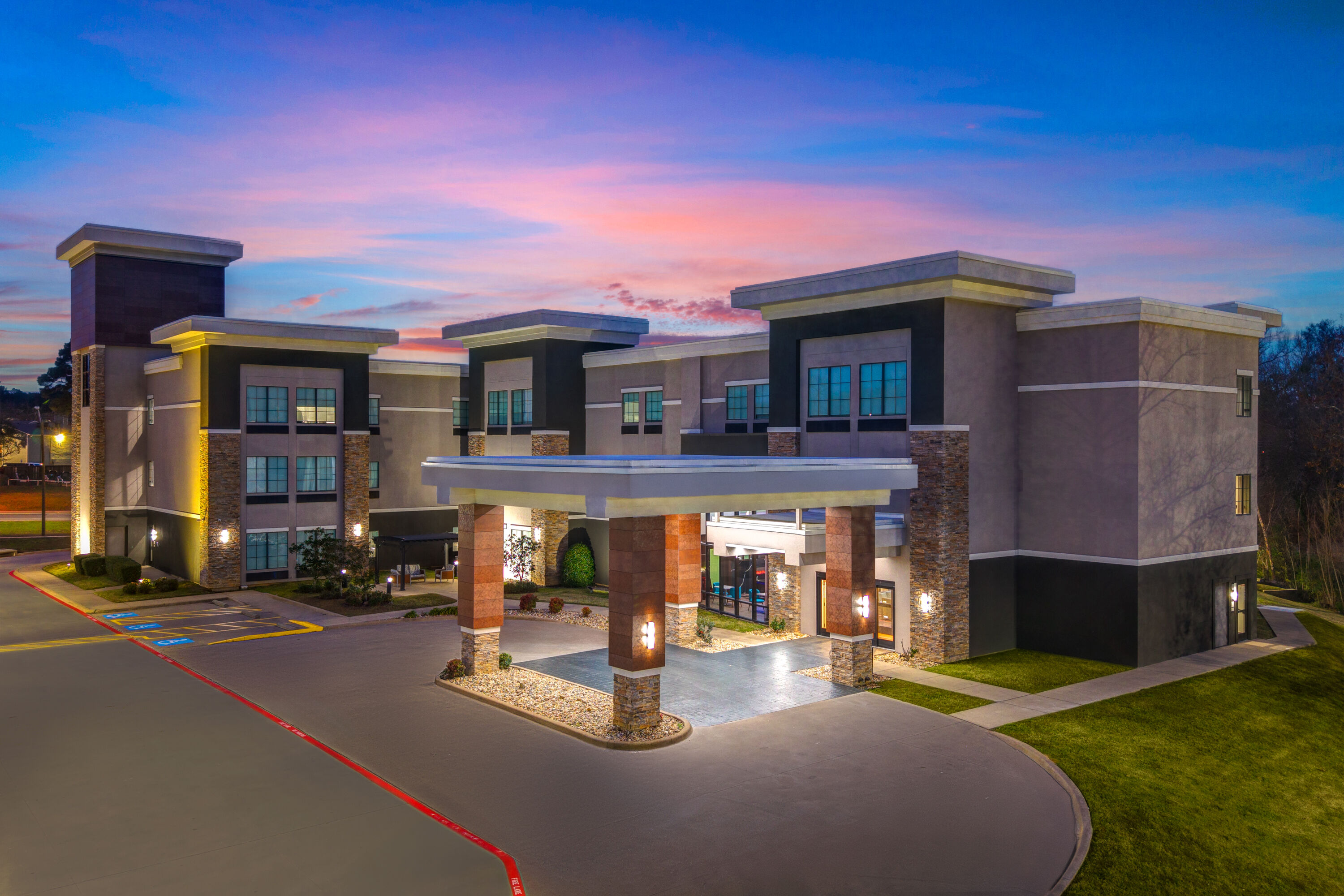 Exterior Dusk Image of La Quinta Inn & Suites by Wyndham Tyler - University Area hotel in Tyler, Texas