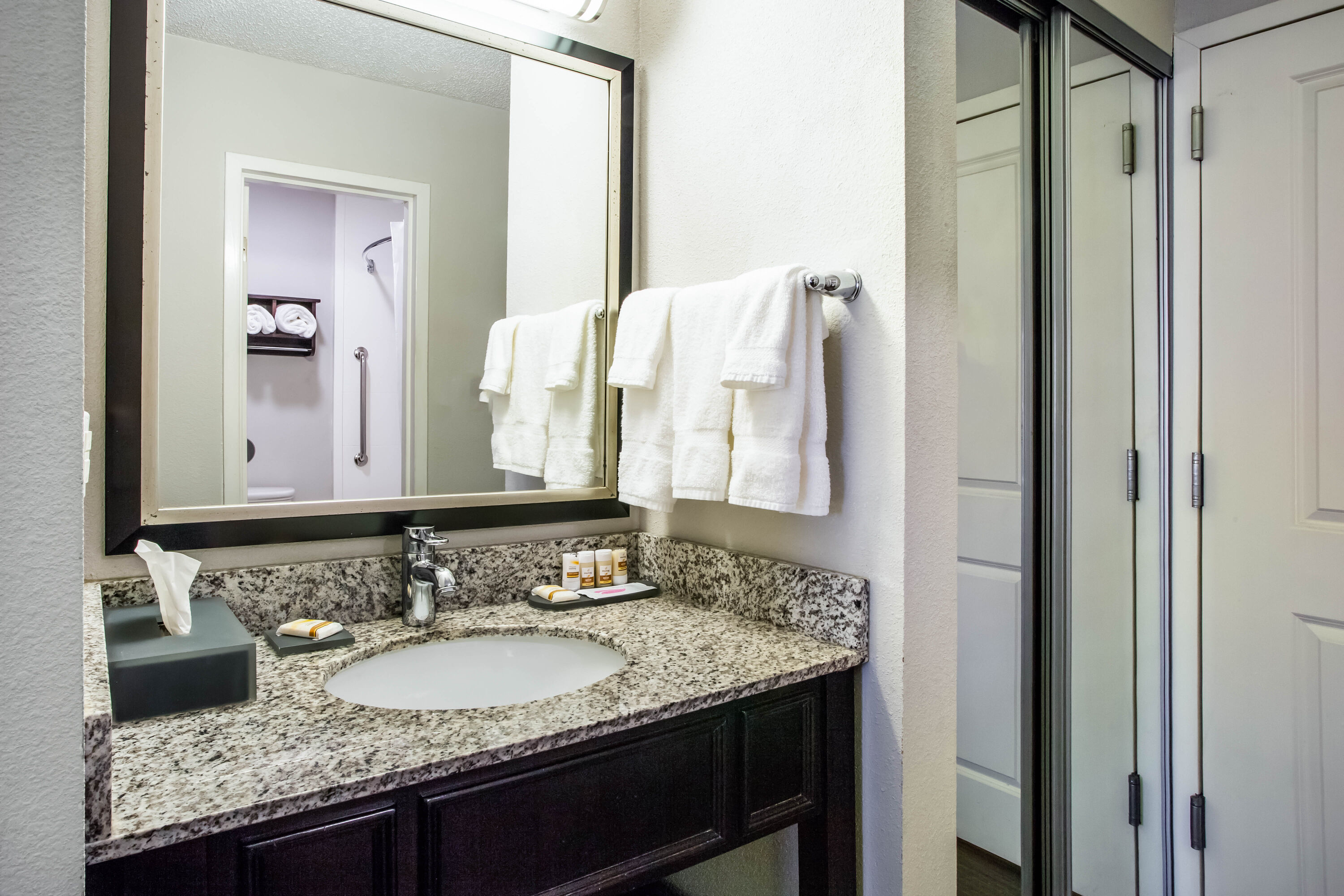 Guest room bath at the La Quinta Inn & Suites by Wyndham Lynchburg at Liberty Univ. in Lynchburg, Virginia