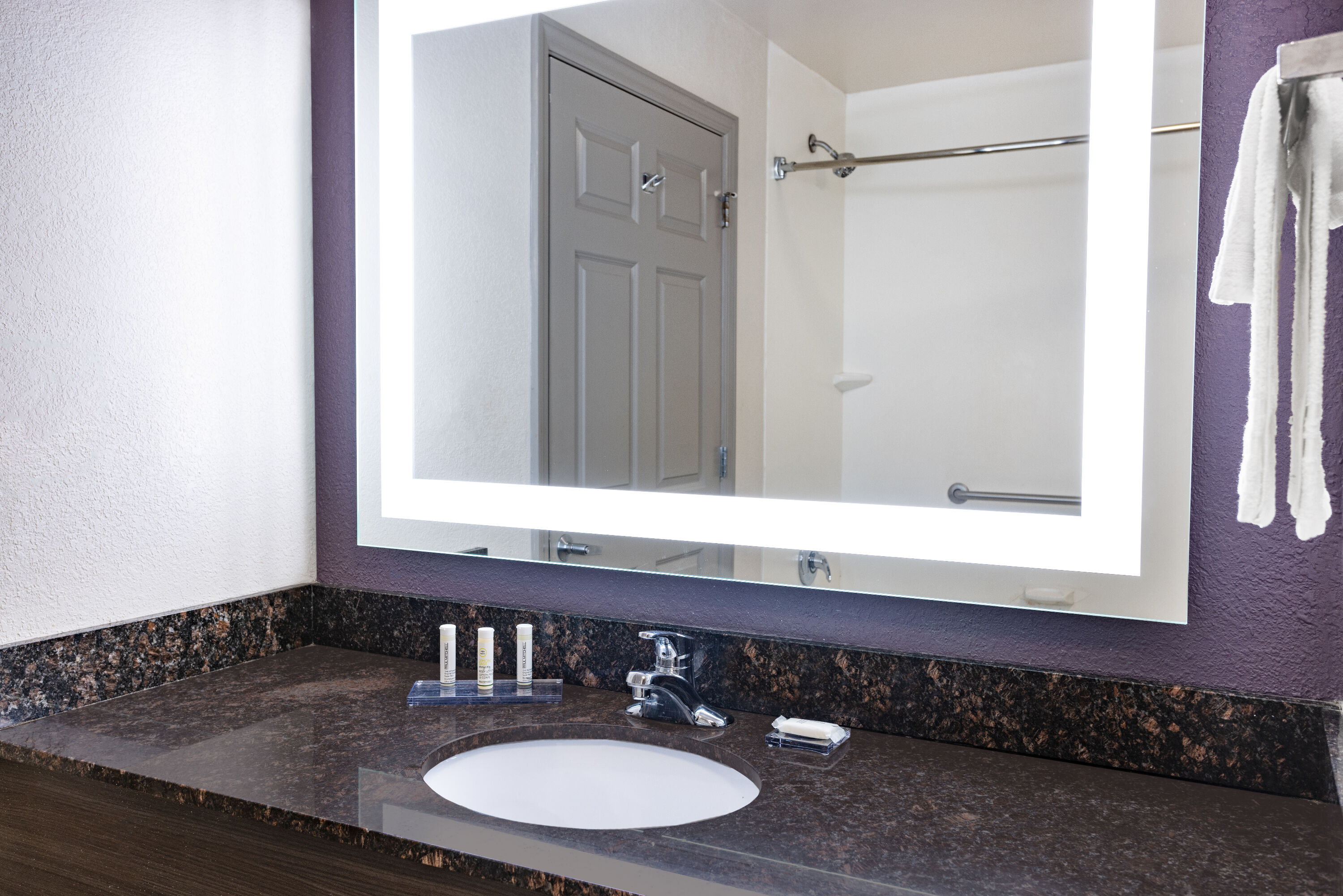 Guest room bath at the La Quinta Inn & Suites by Wyndham Norfolk in Norfolk, Virginia
