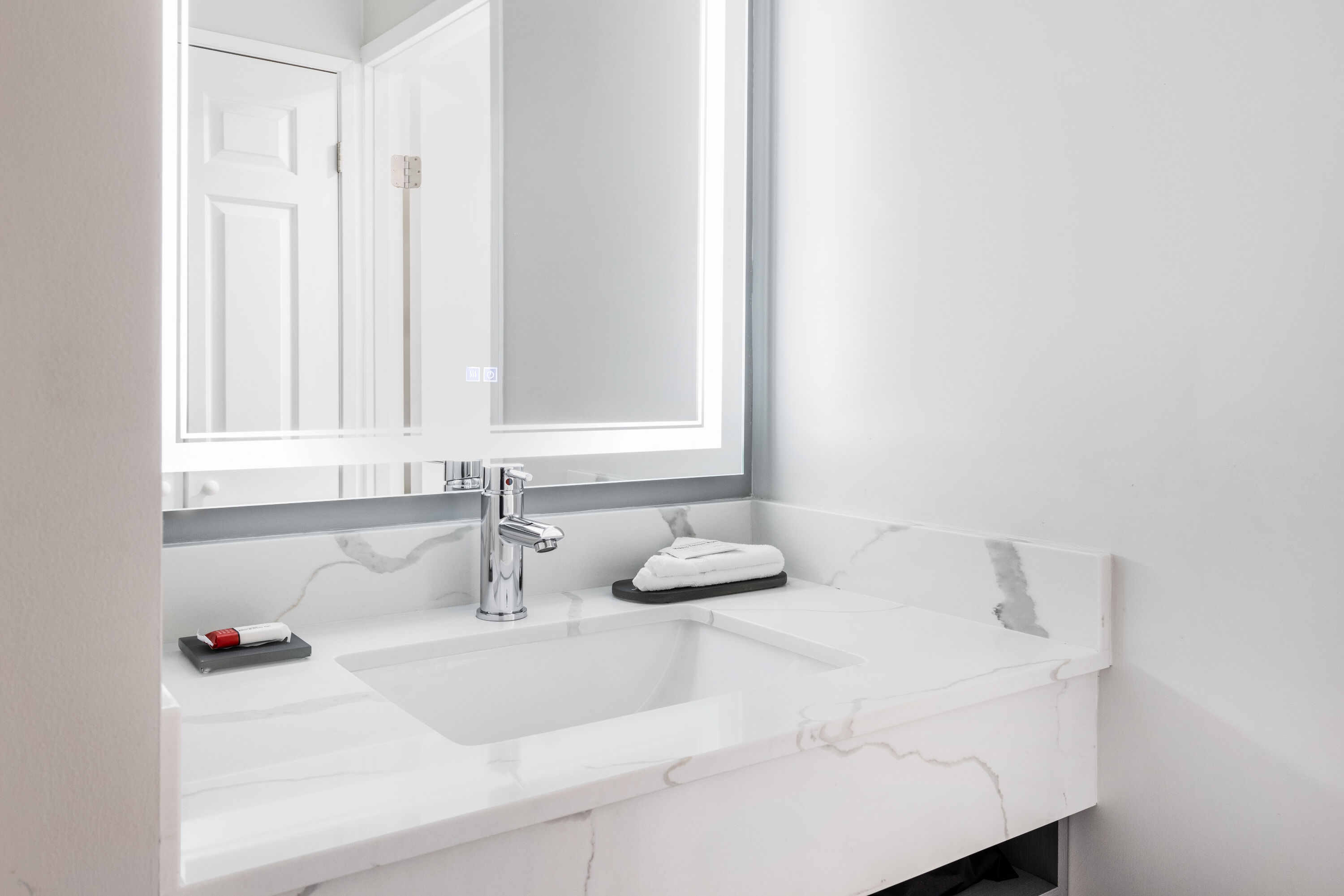 Guest room bath at the La Quinta Inn by Wyndham Lynnwood in Lynnwood, Washington