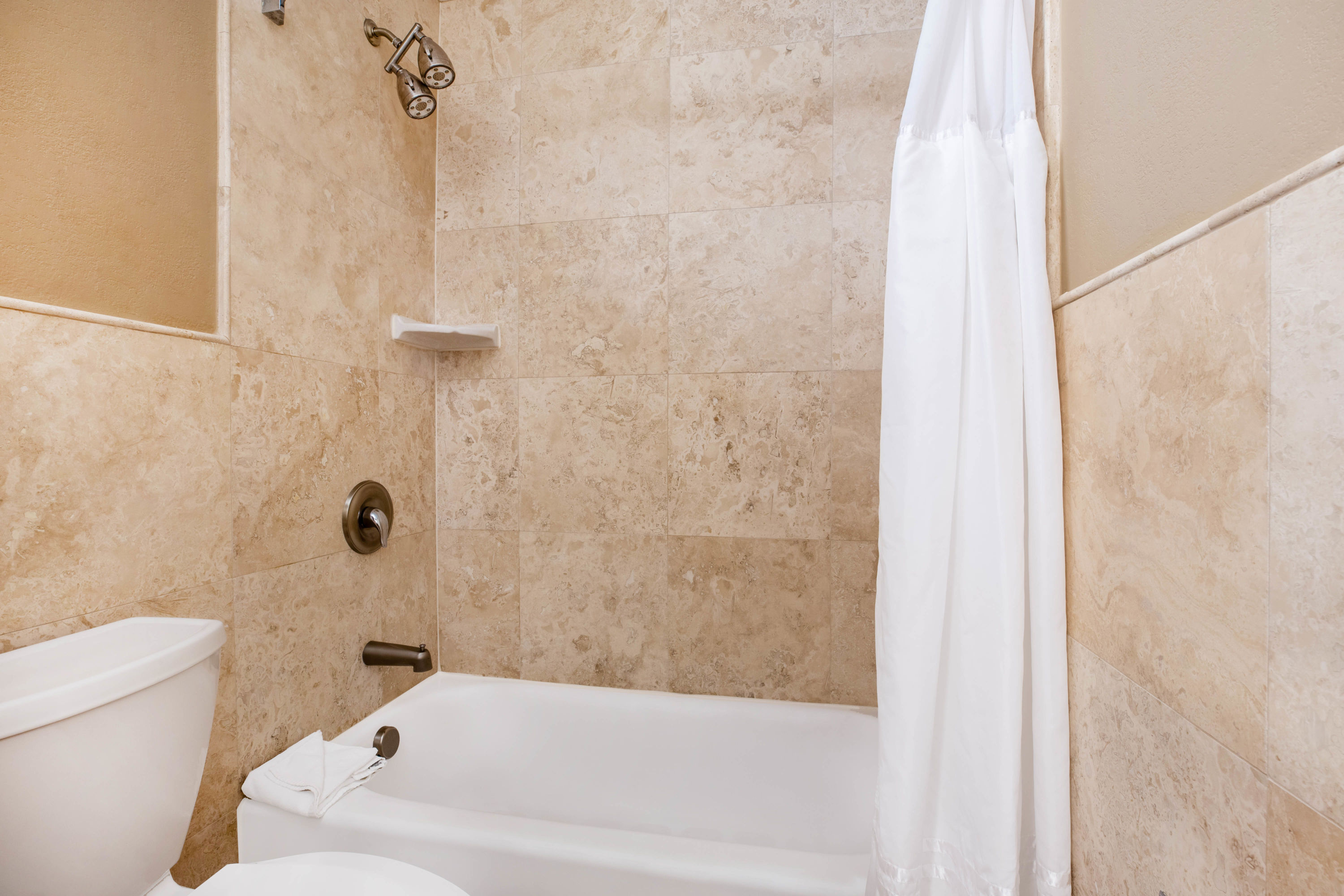 Guest room bath at the La Quinta Inn & Suites by Wyndham Seattle Downtown in Seattle, Washington