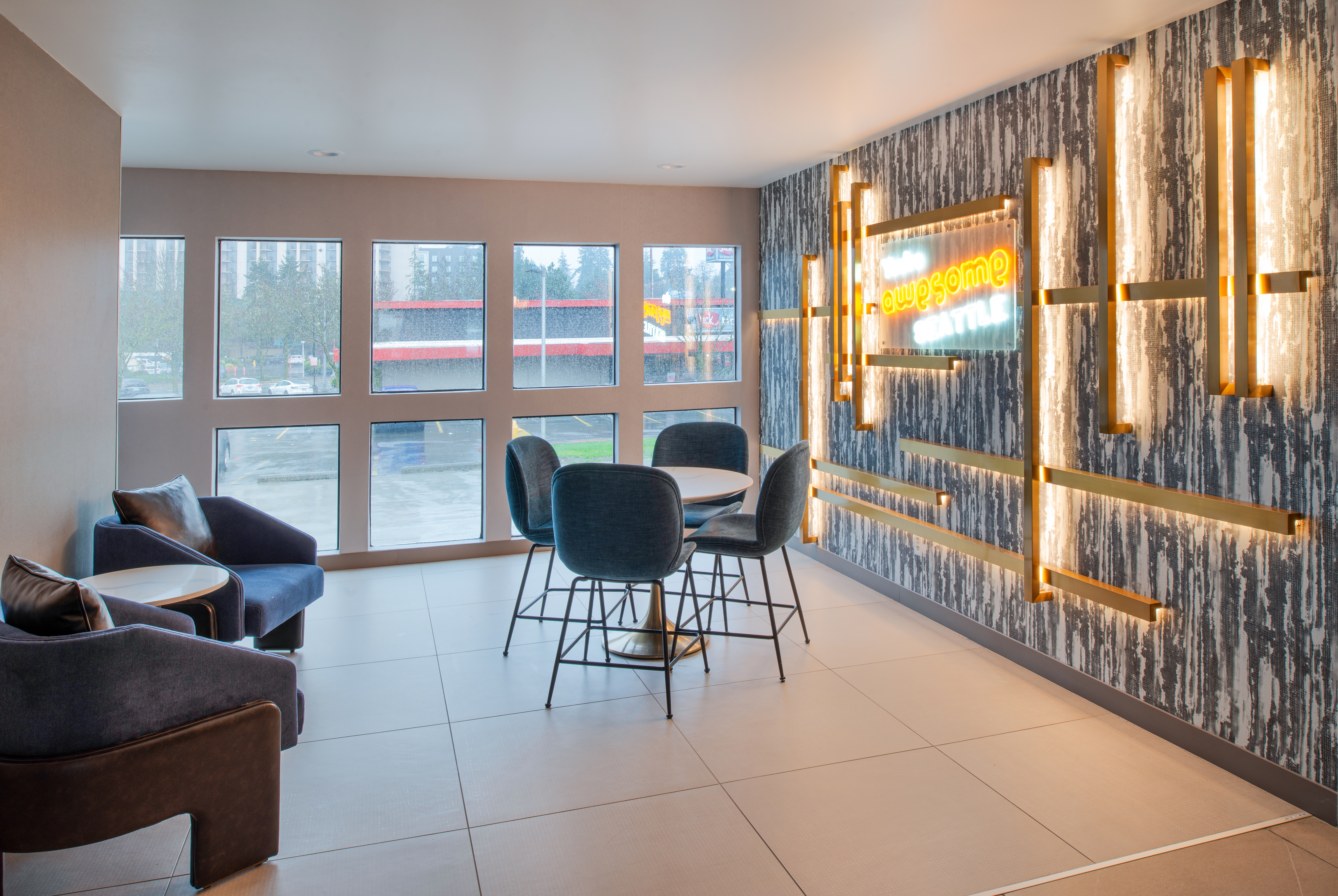 La Quinta Inn & Suites by Wyndham Seattle Sea-Tac Airport restaurant breakfast area with seating in Seattle, Washington