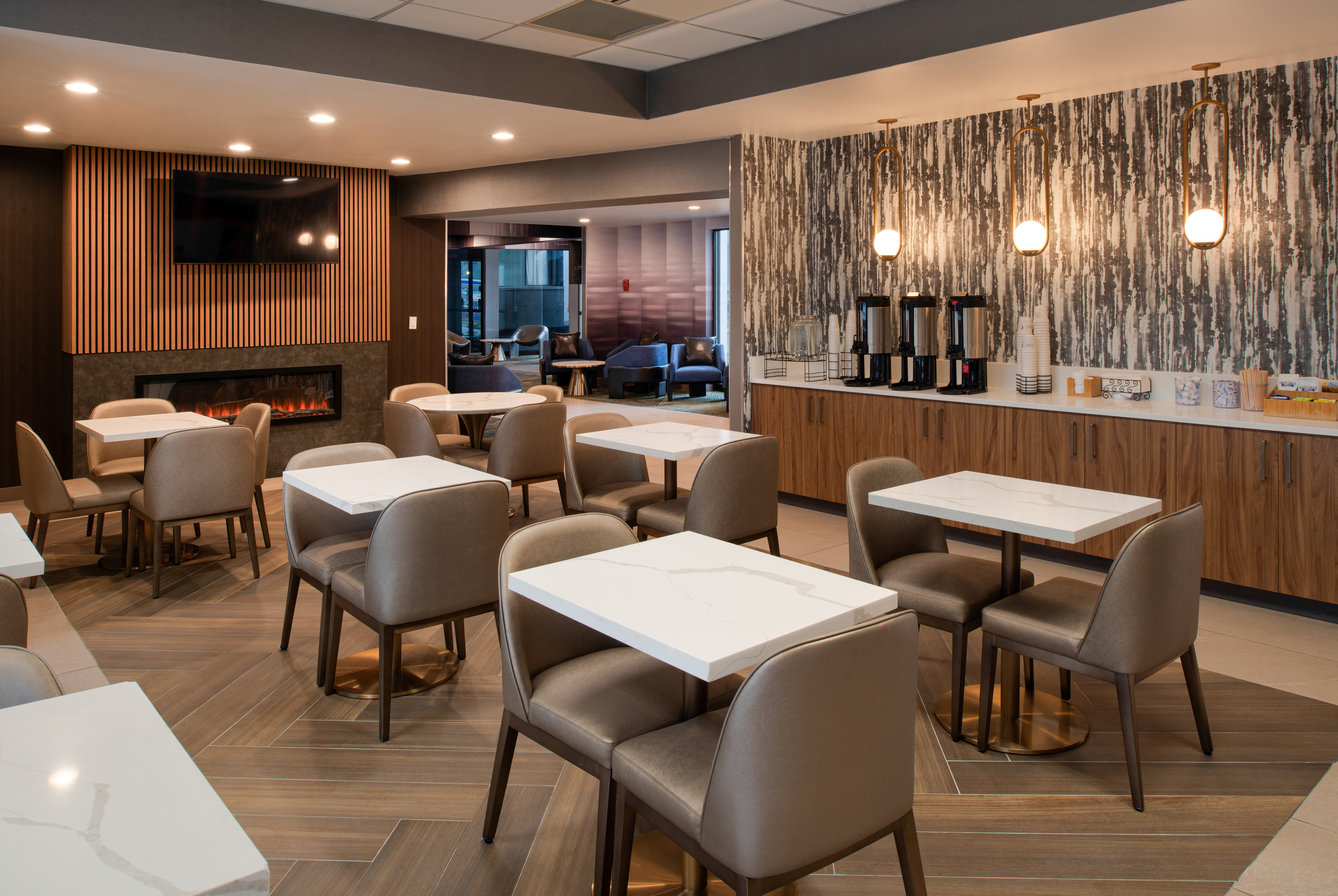 La Quinta Inn & Suites by Wyndham Seattle Sea-Tac Airport restaurant breakfast area with seating in Seattle, Washington