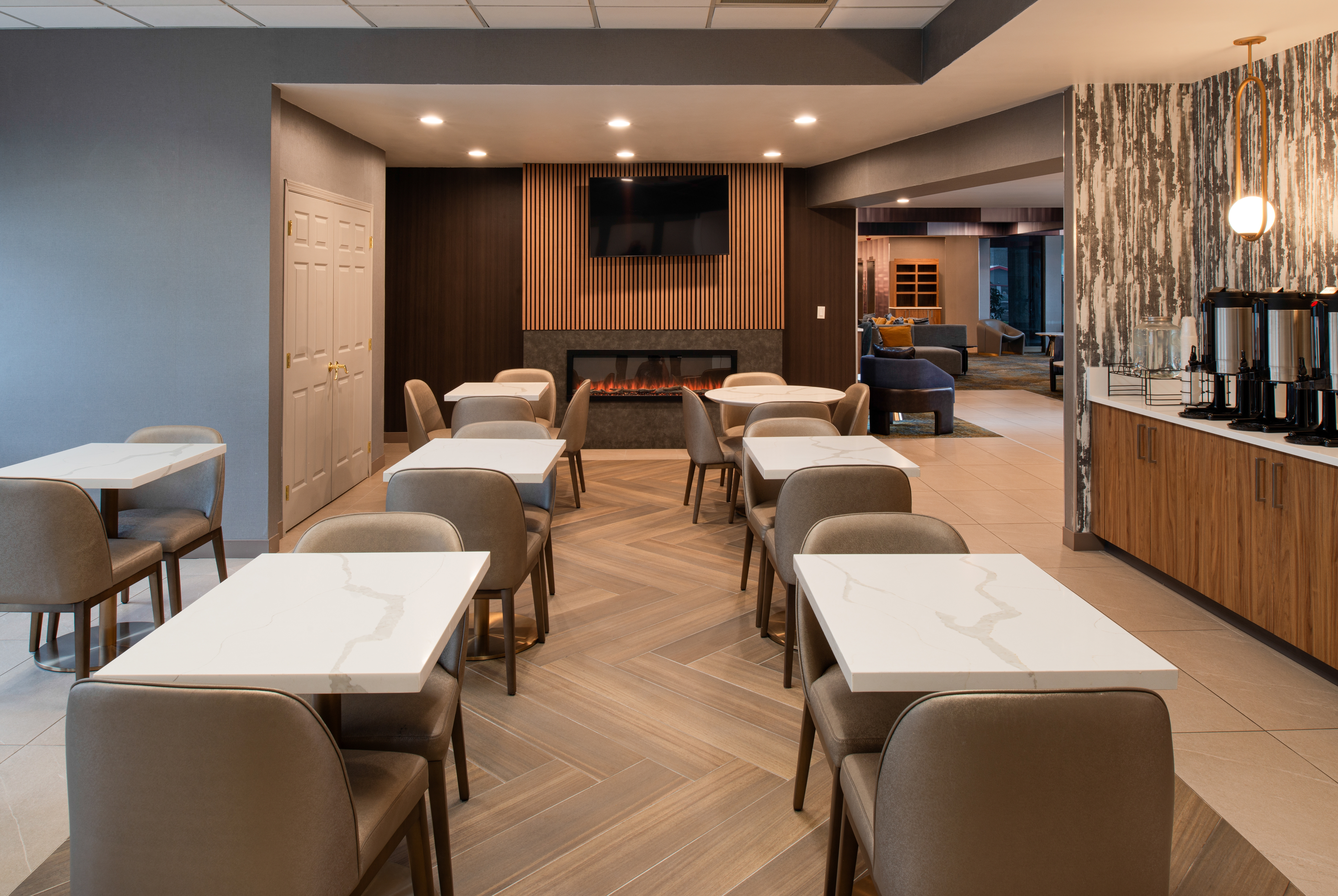 La Quinta Inn & Suites by Wyndham Seattle Sea-Tac Airport restaurant breakfast area with seating in Seattle, Washington