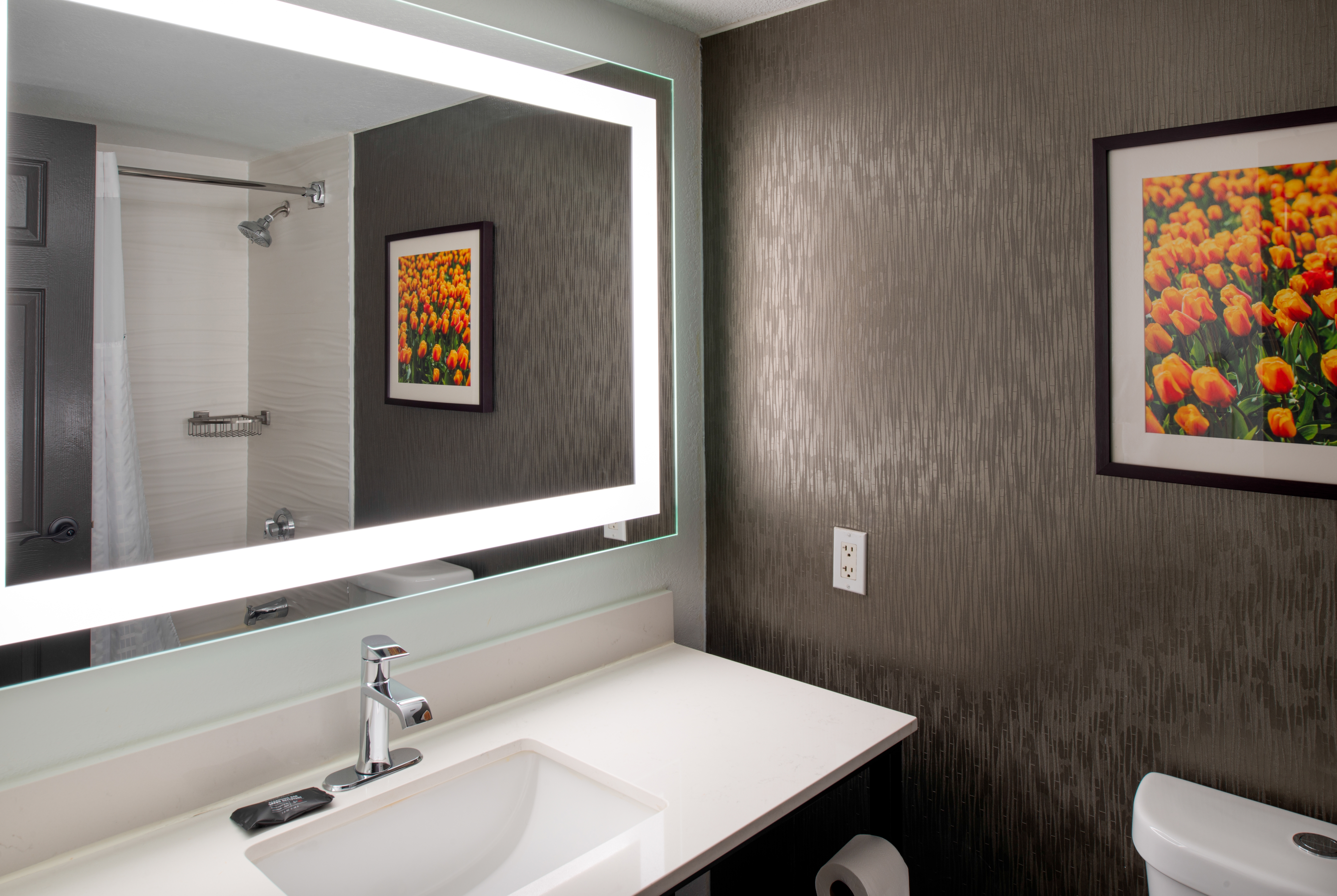 Guest room bath at the La Quinta Inn & Suites by Wyndham Seattle Sea-Tac Airport in Seattle, Washington