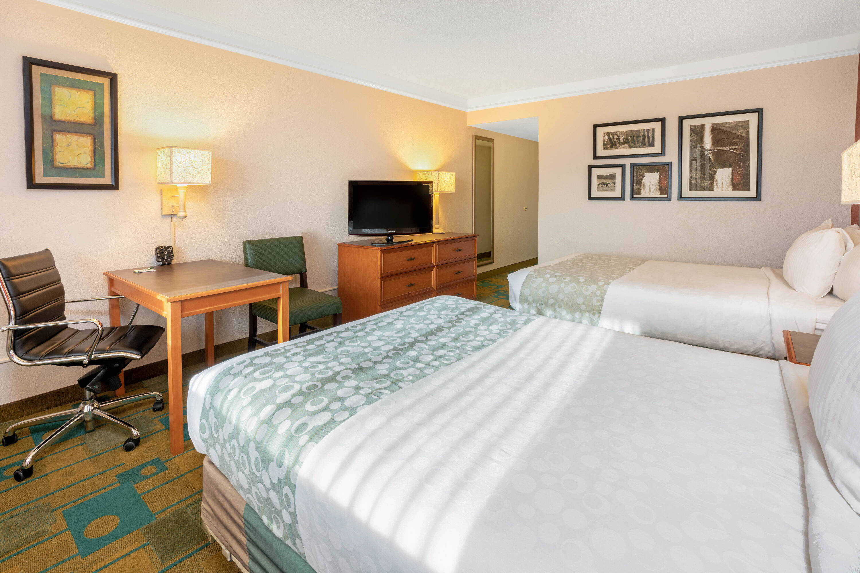 Guest room at the La Quinta Inn & Suites by Wyndham Seattle Sea-Tac Airport in Seattle, Washington
