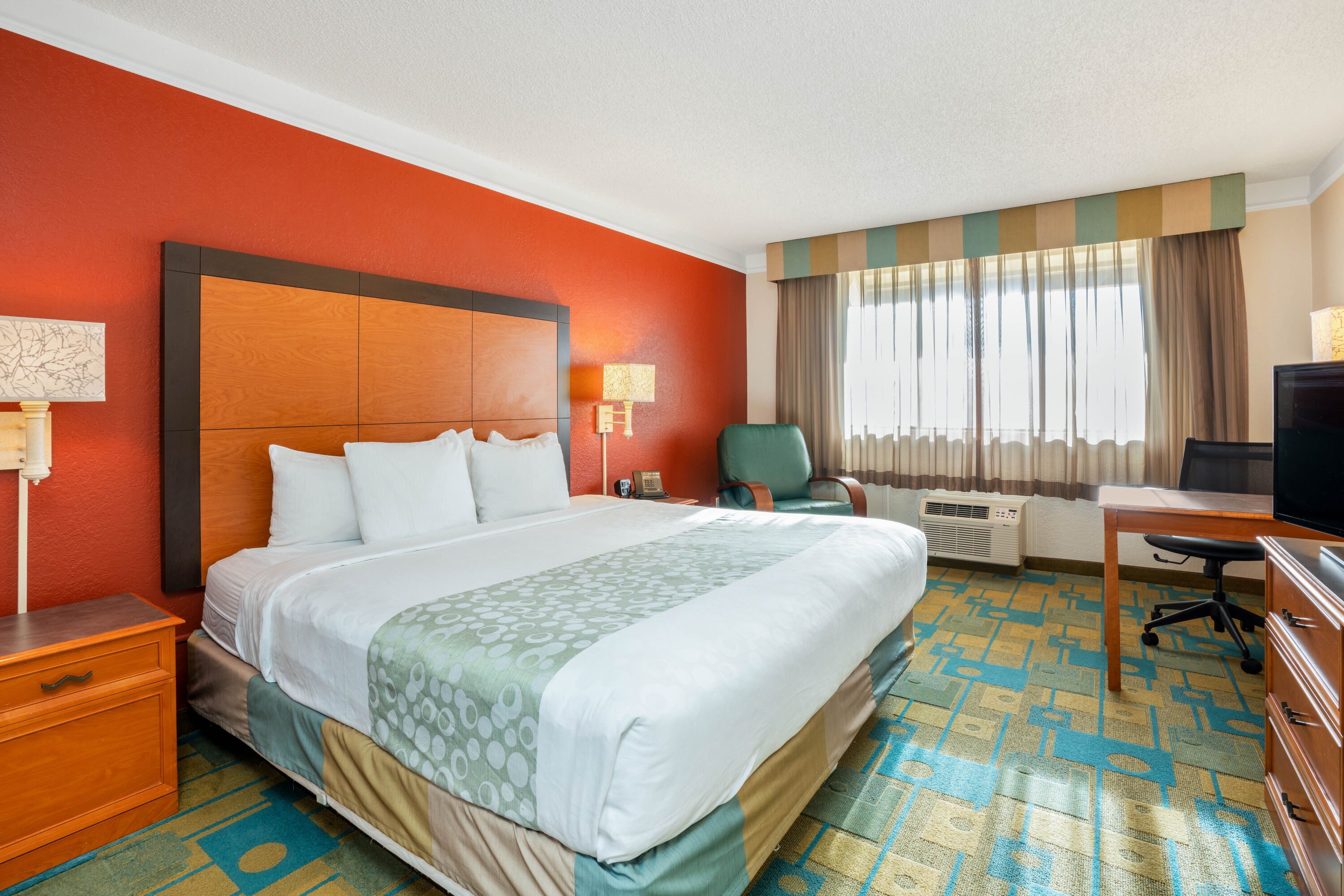 Guest room at the La Quinta Inn & Suites by Wyndham Seattle Sea-Tac Airport in Seattle, Washington