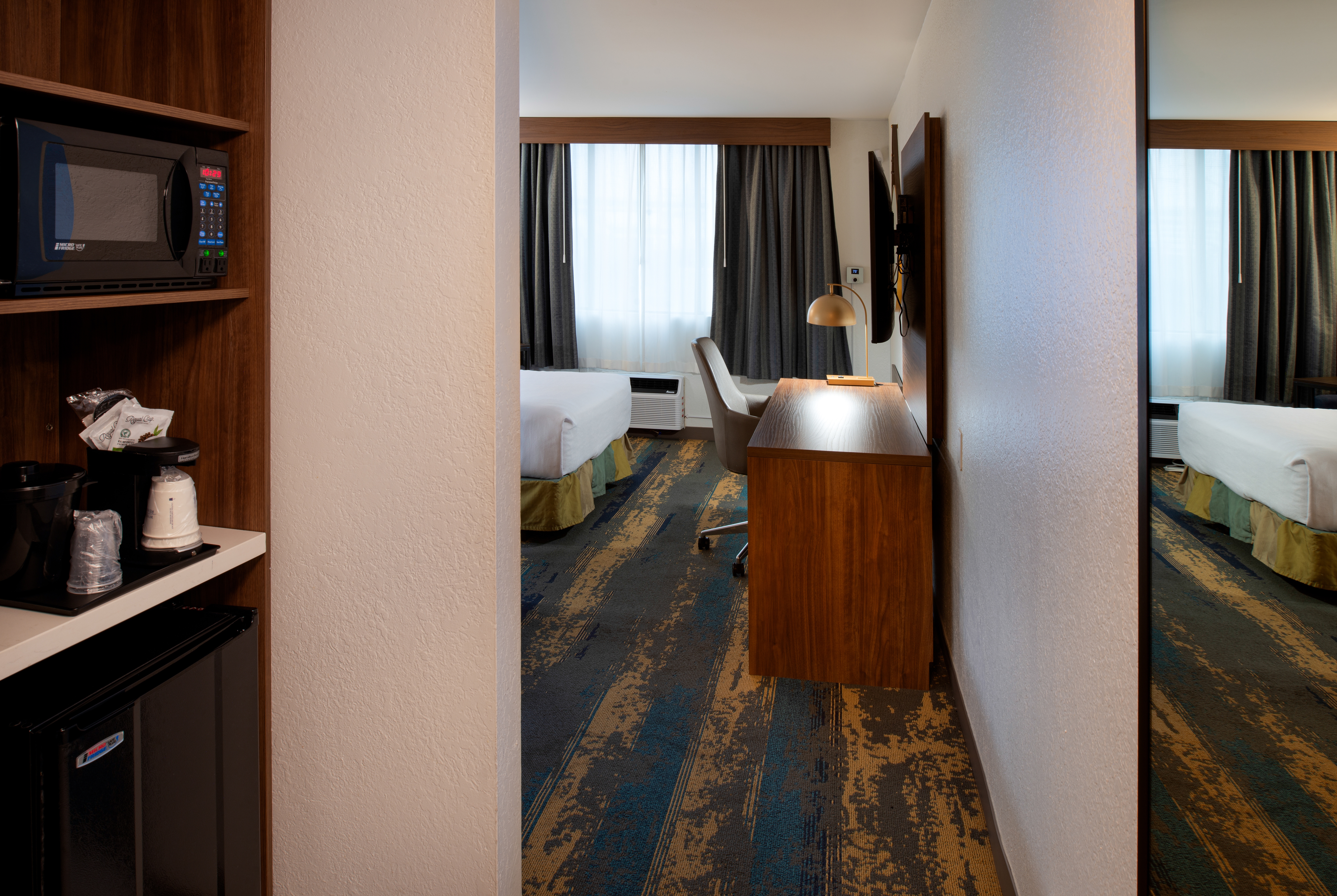 Double bed guest room at the La Quinta Inn & Suites by Wyndham Seattle Sea-Tac Airport in Seattle, Washington