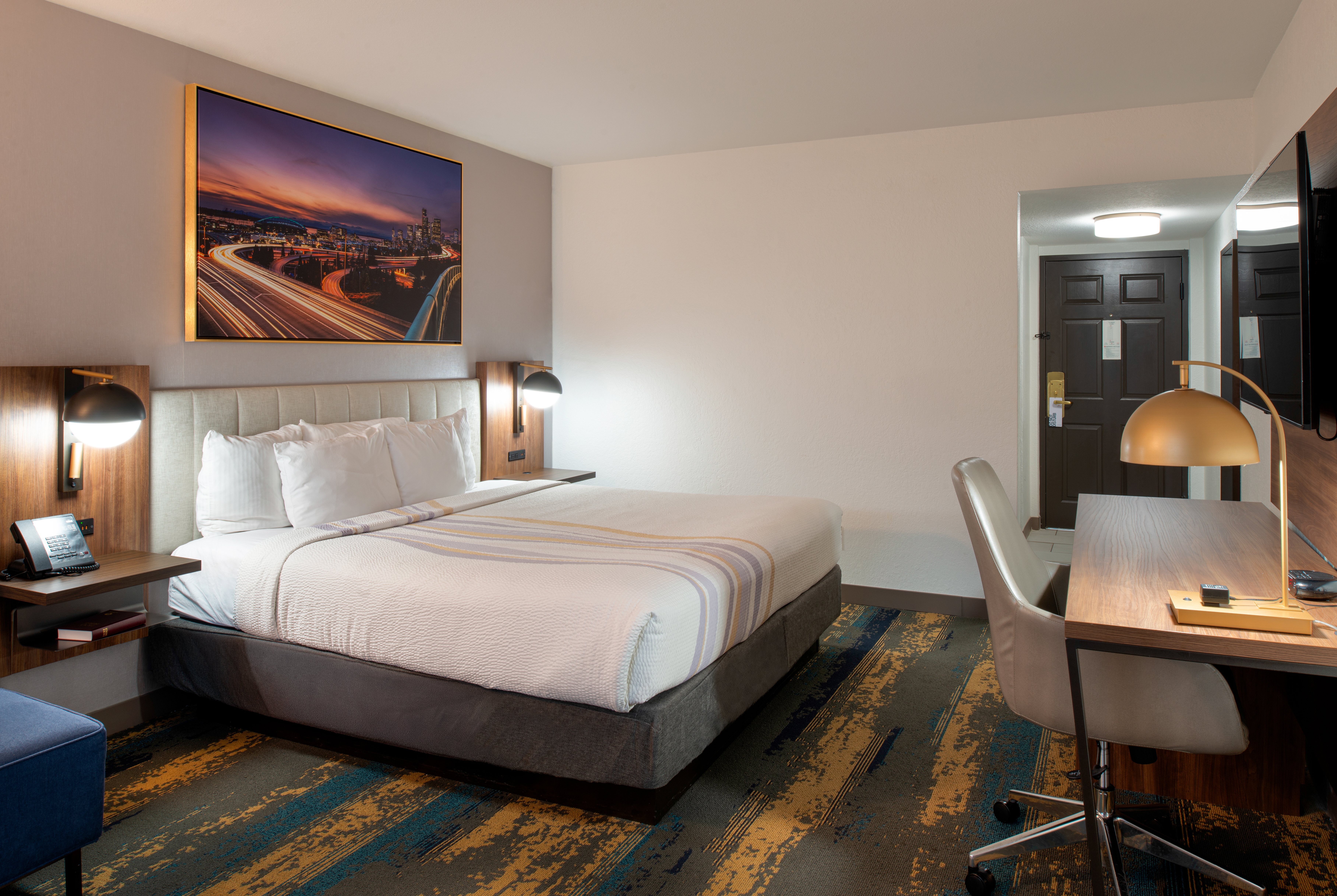 King bed guest room at the La Quinta Inn & Suites by Wyndham Seattle Sea-Tac Airport in Seattle, Washington