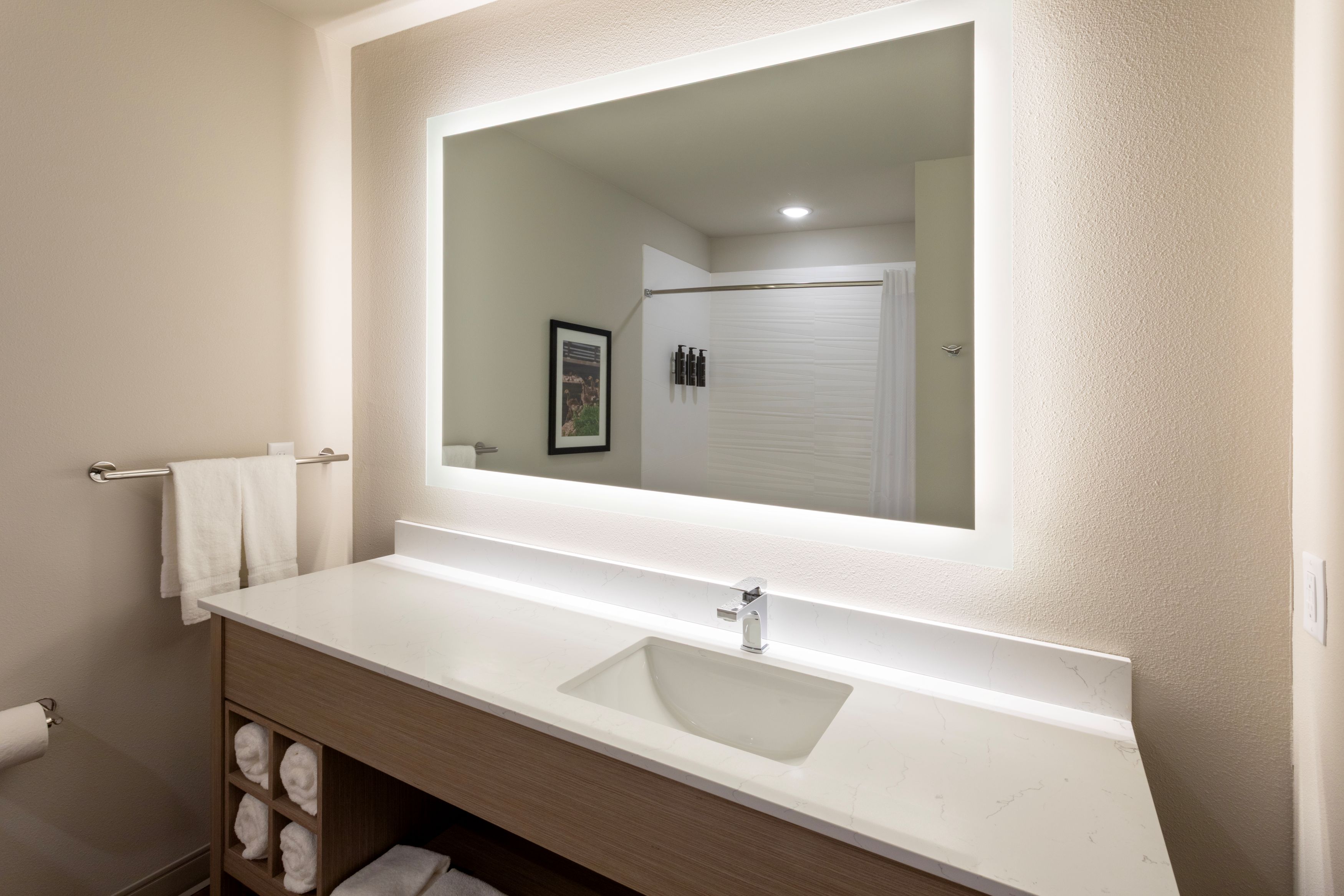 Guest room bath at the La Quinta Inn & Suites by Wyndham Kaukauna in Kaukauna, Wisconsin