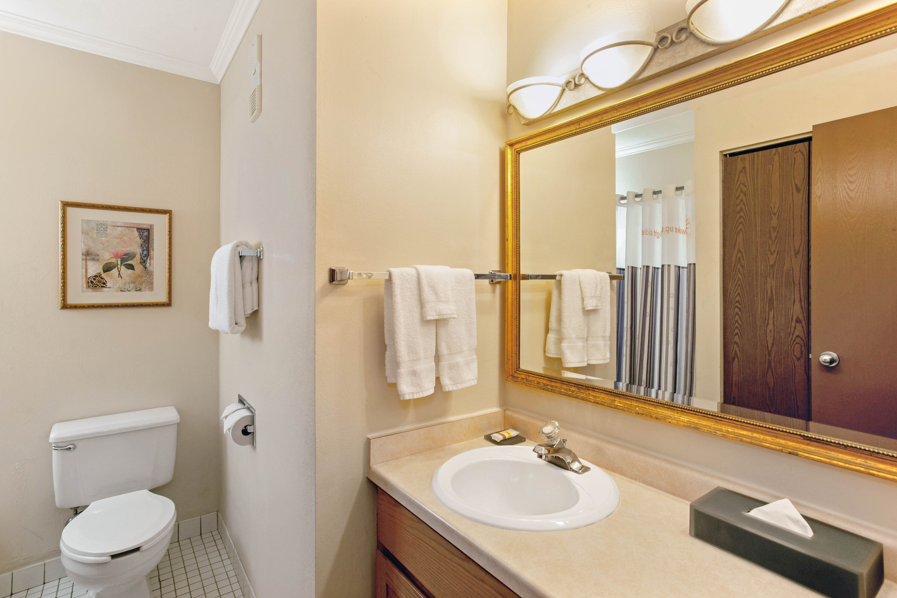 Guest room bath at the La Quinta Inn & Suites by Wyndham Stevens Point in Stevens Point, Wisconsin