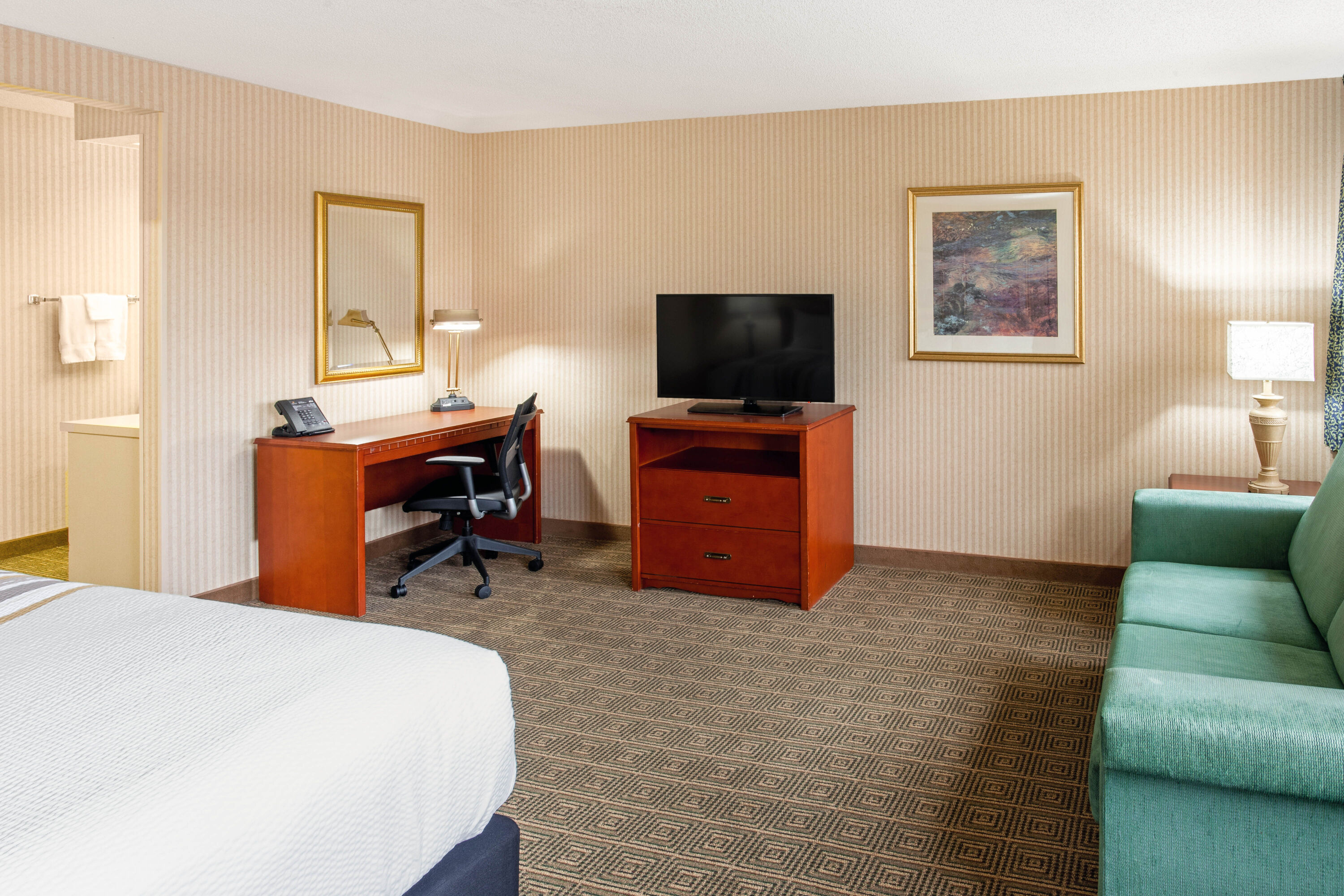Guest room at the La Quinta Inn & Suites by Wyndham Stevens Point in Stevens Point, Wisconsin