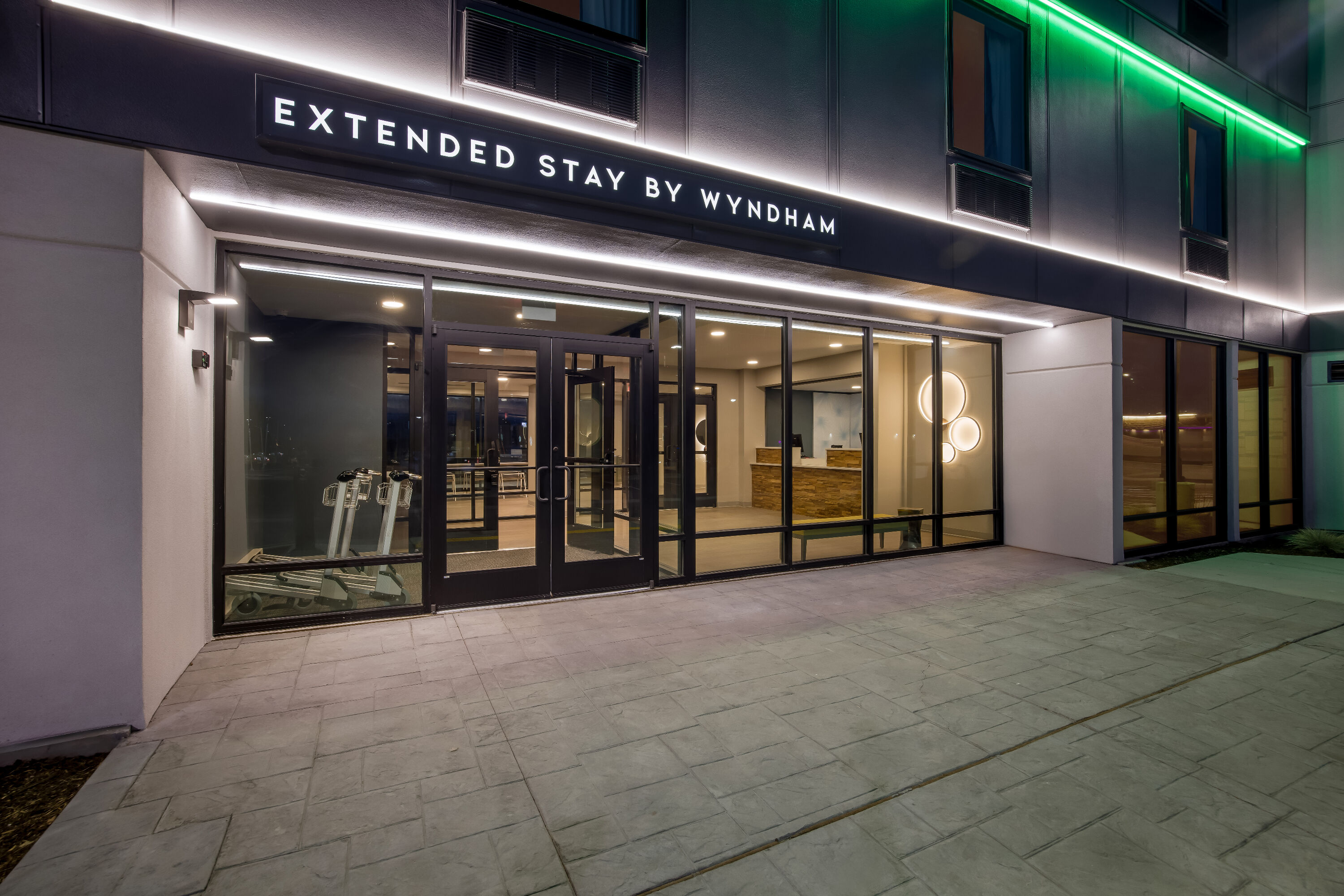 Exterior Night Image of ECHO Suites Extended Stay by Wyndham Colorado Springs Airpt hotel in Colorado Springs, Colorado