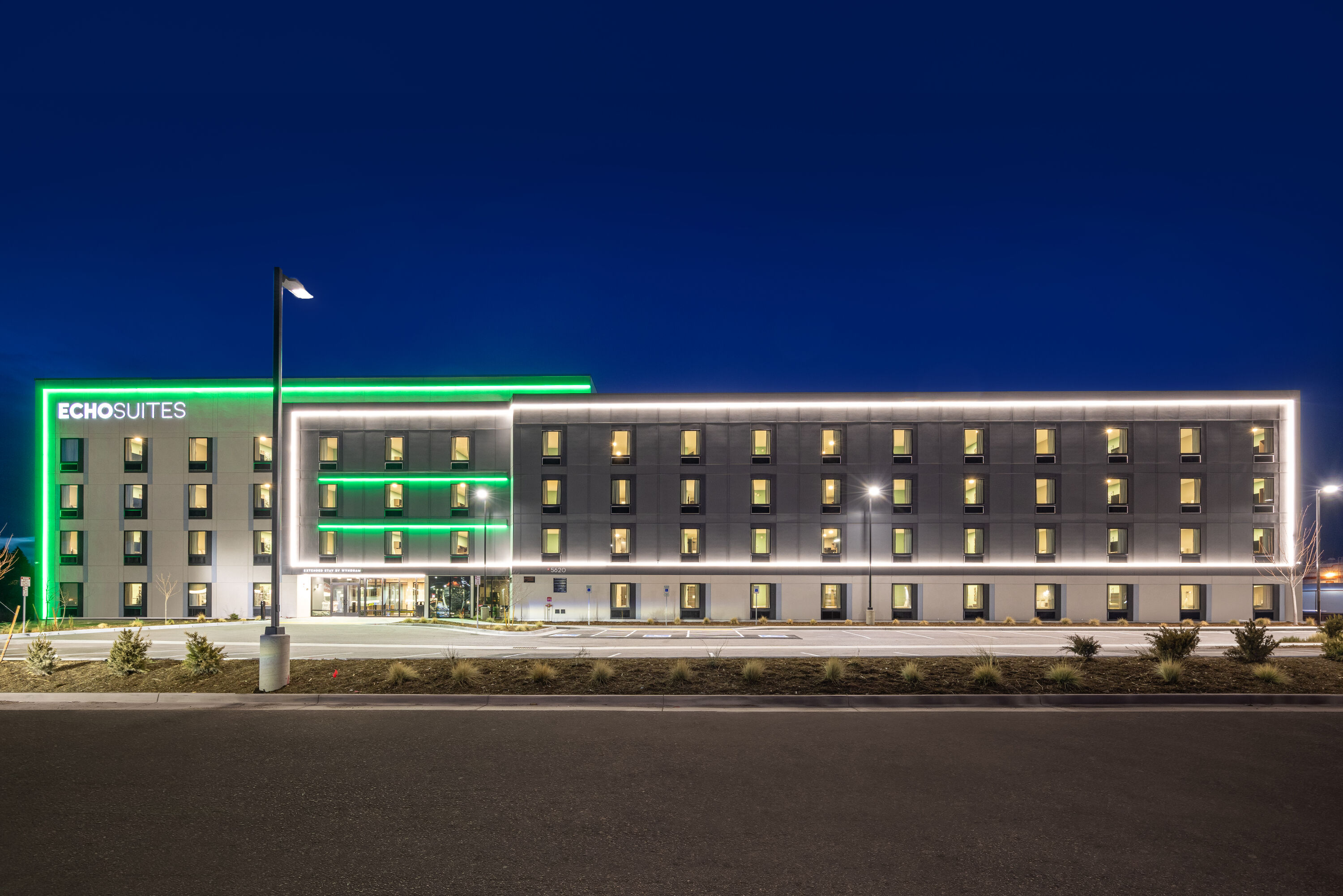 Exterior Night Image of ECHO Suites Extended Stay by Wyndham Colorado Springs Airpt hotel in Colorado Springs, Colorado