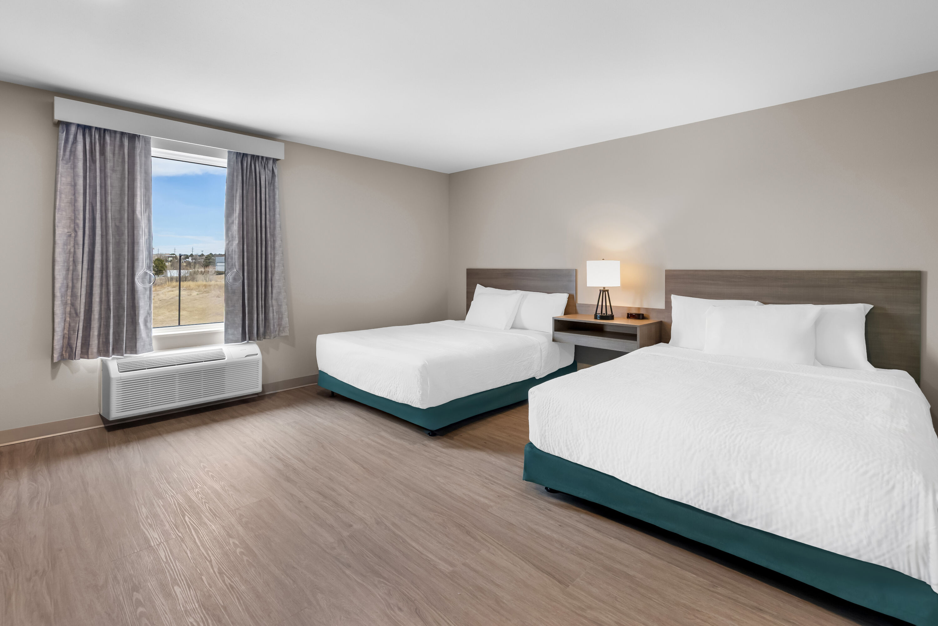 Double bed guest room at the ECHO Suites Extended Stay by Wyndham Colorado Springs Airpt in Colorado Springs, Colorado