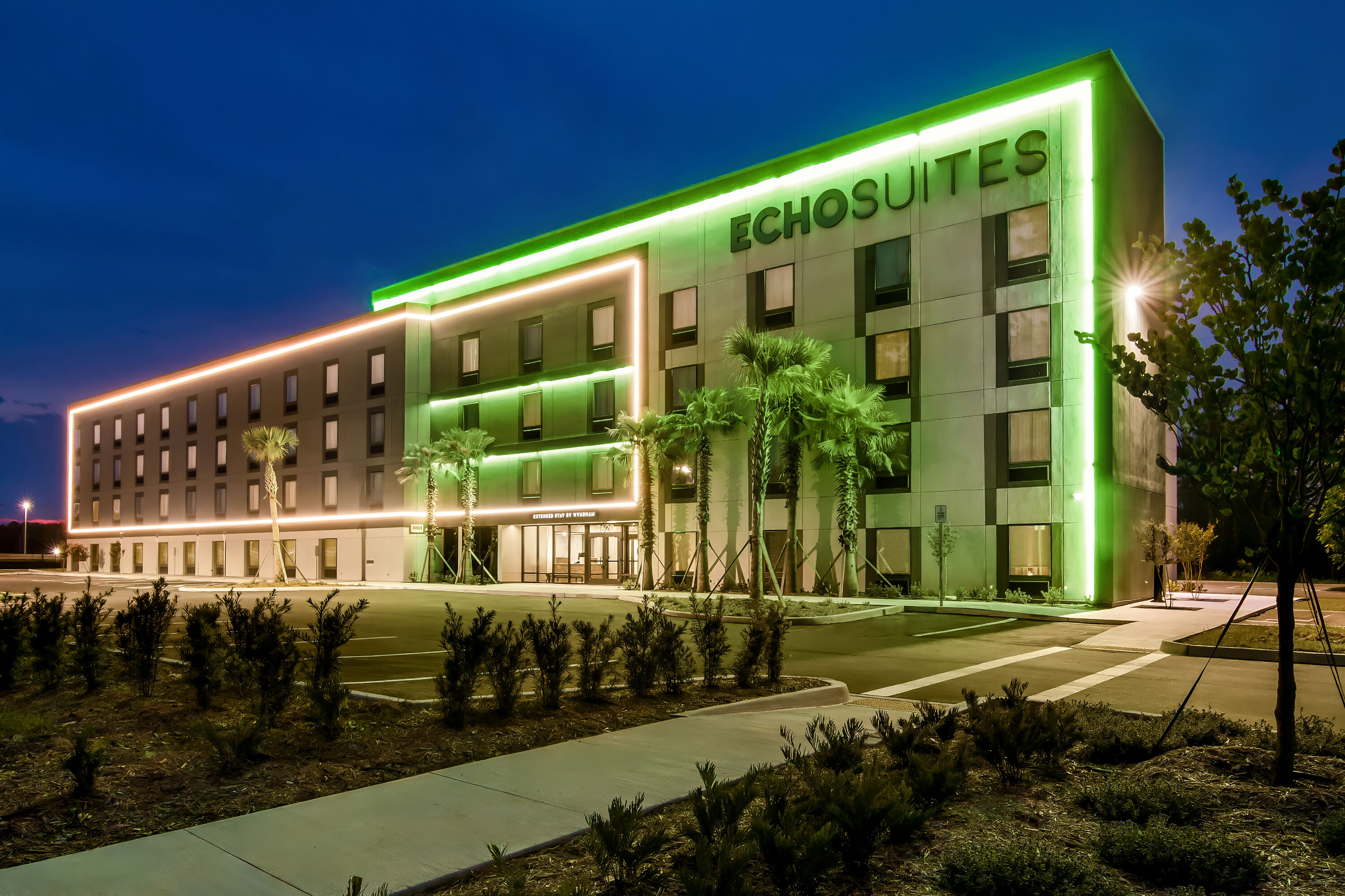 Exterior Night Image of ECHO Suites Extended Stay by Wyndham Middleburg hotel in Middleburg, Florida