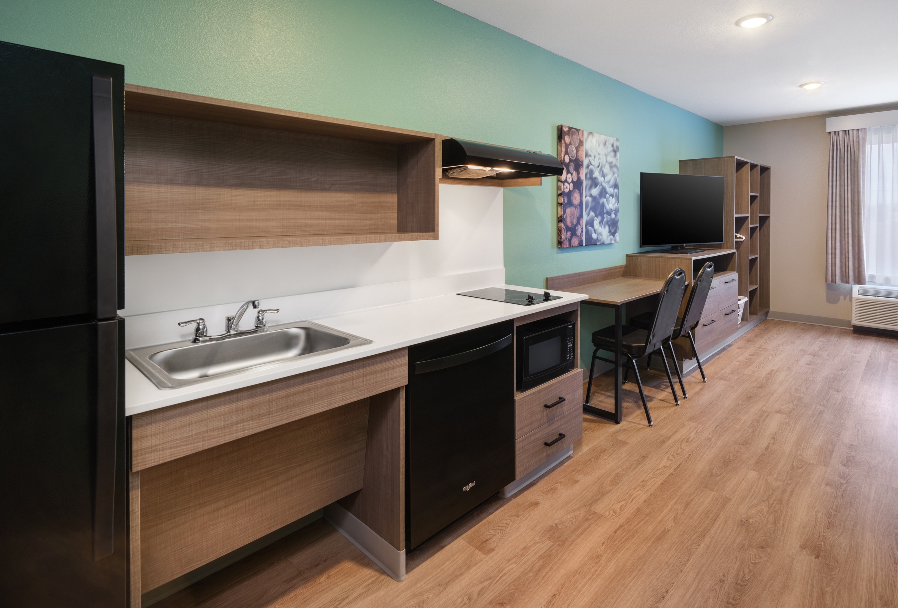 Guest room at the ECHO Suites Extended Stay by Wyndham Middleburg in Middleburg, Florida