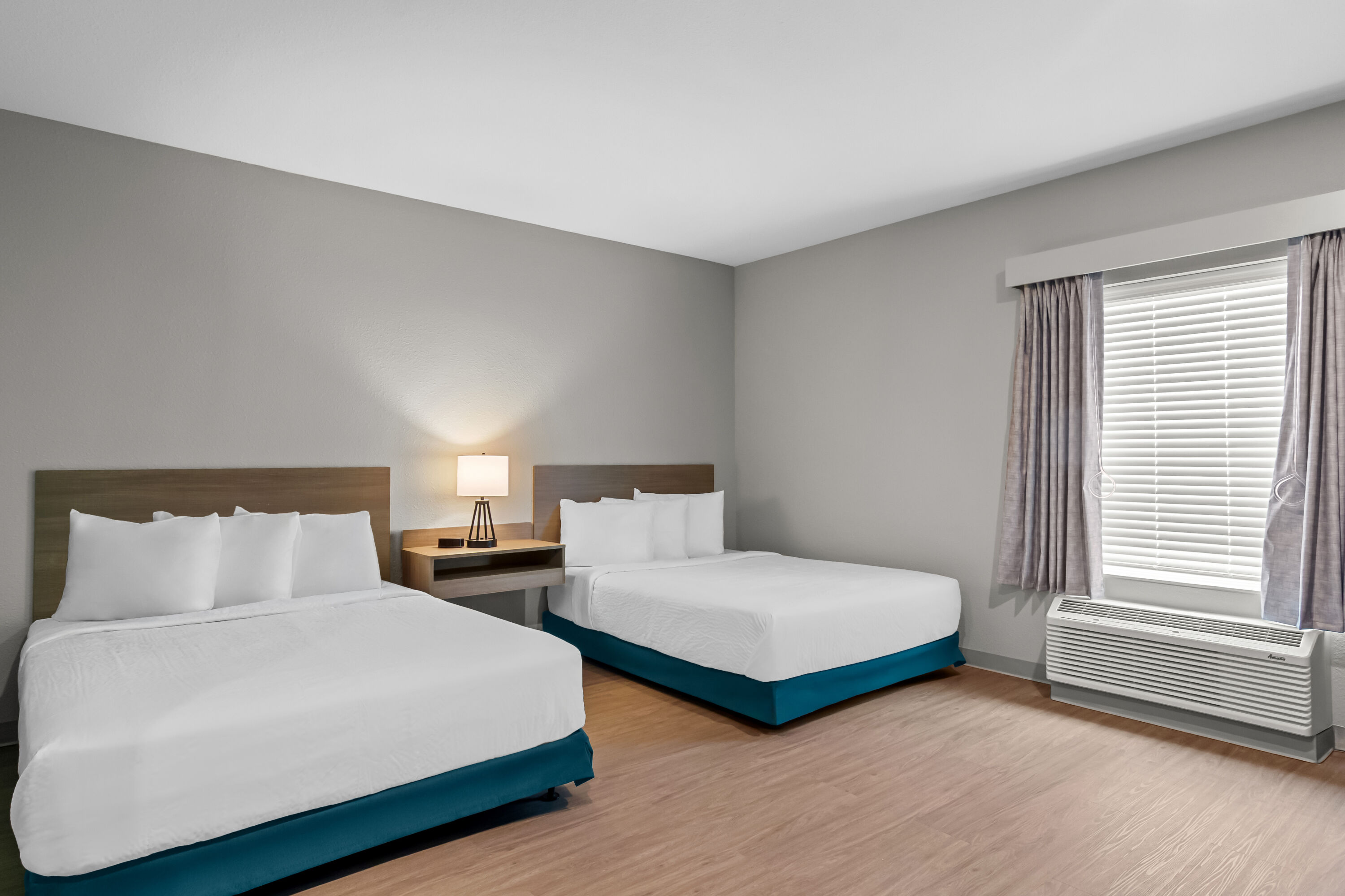 Double bed guest room at the ECHO Suites Extended Stay by Wyndham Middleburg in Middleburg, Florida
