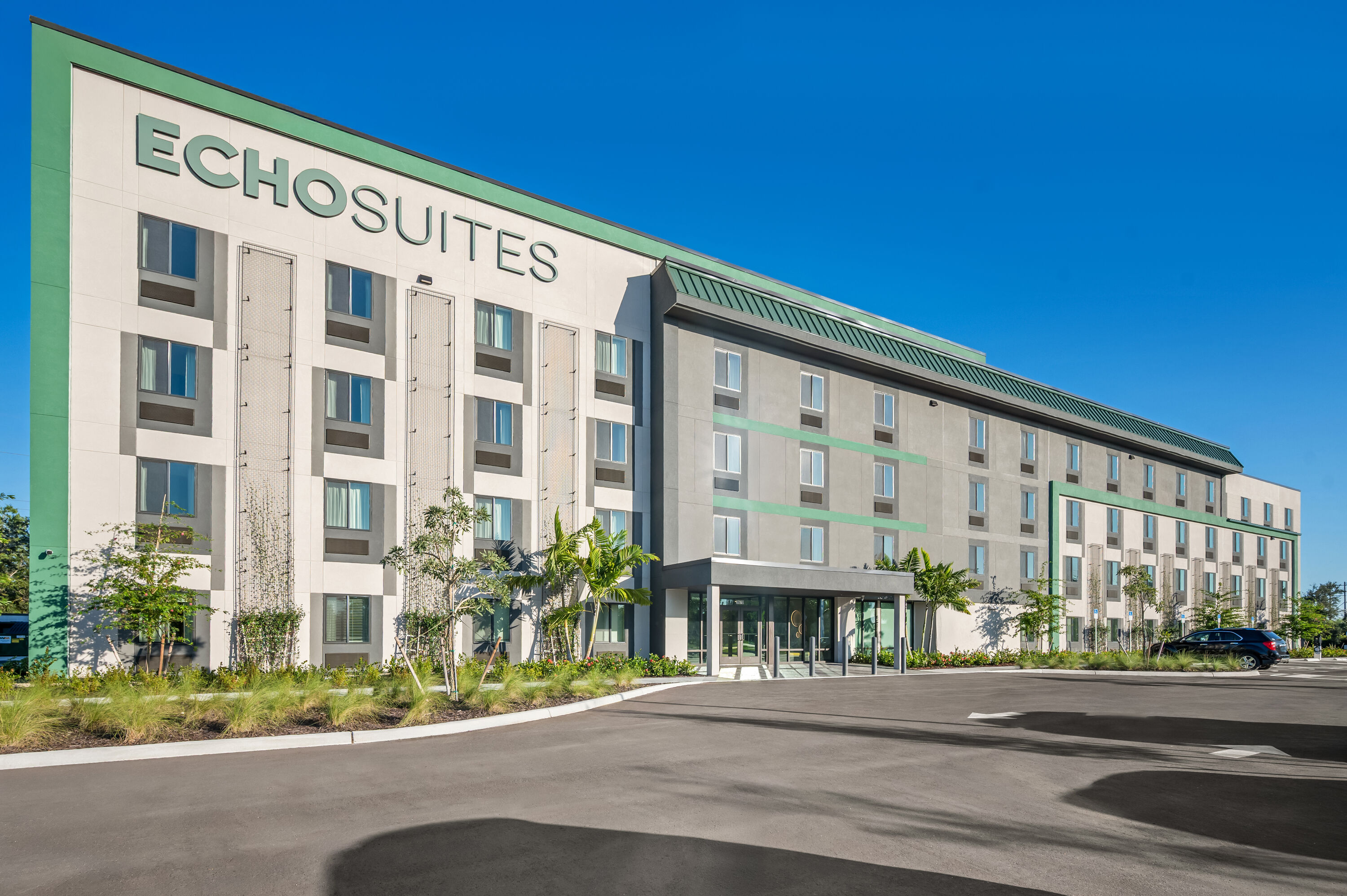 Exterior Day Image of ECHO Suites Extended Stay by Wyndham Naples hotel in Naples, Florida