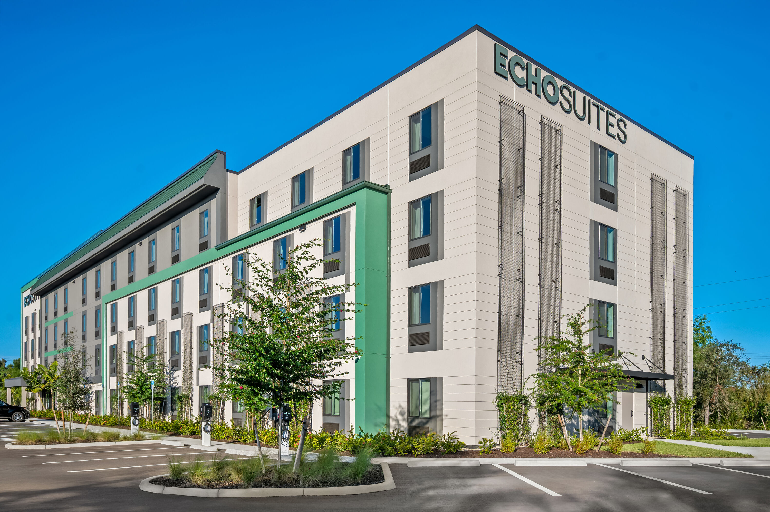 Exterior Day Image of ECHO Suites Extended Stay by Wyndham Naples hotel in Naples, Florida