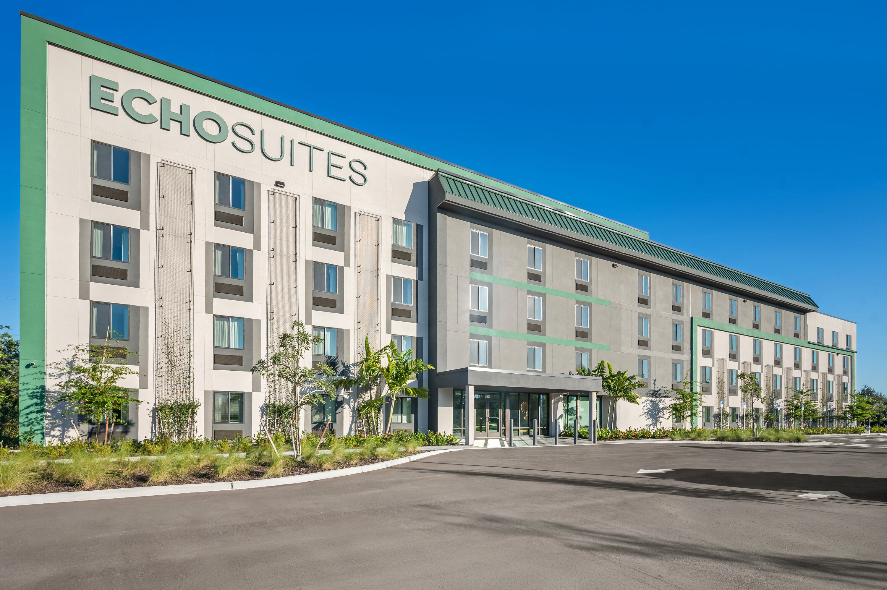 Exterior Day Image of ECHO Suites Extended Stay by Wyndham Naples hotel in Naples, Florida