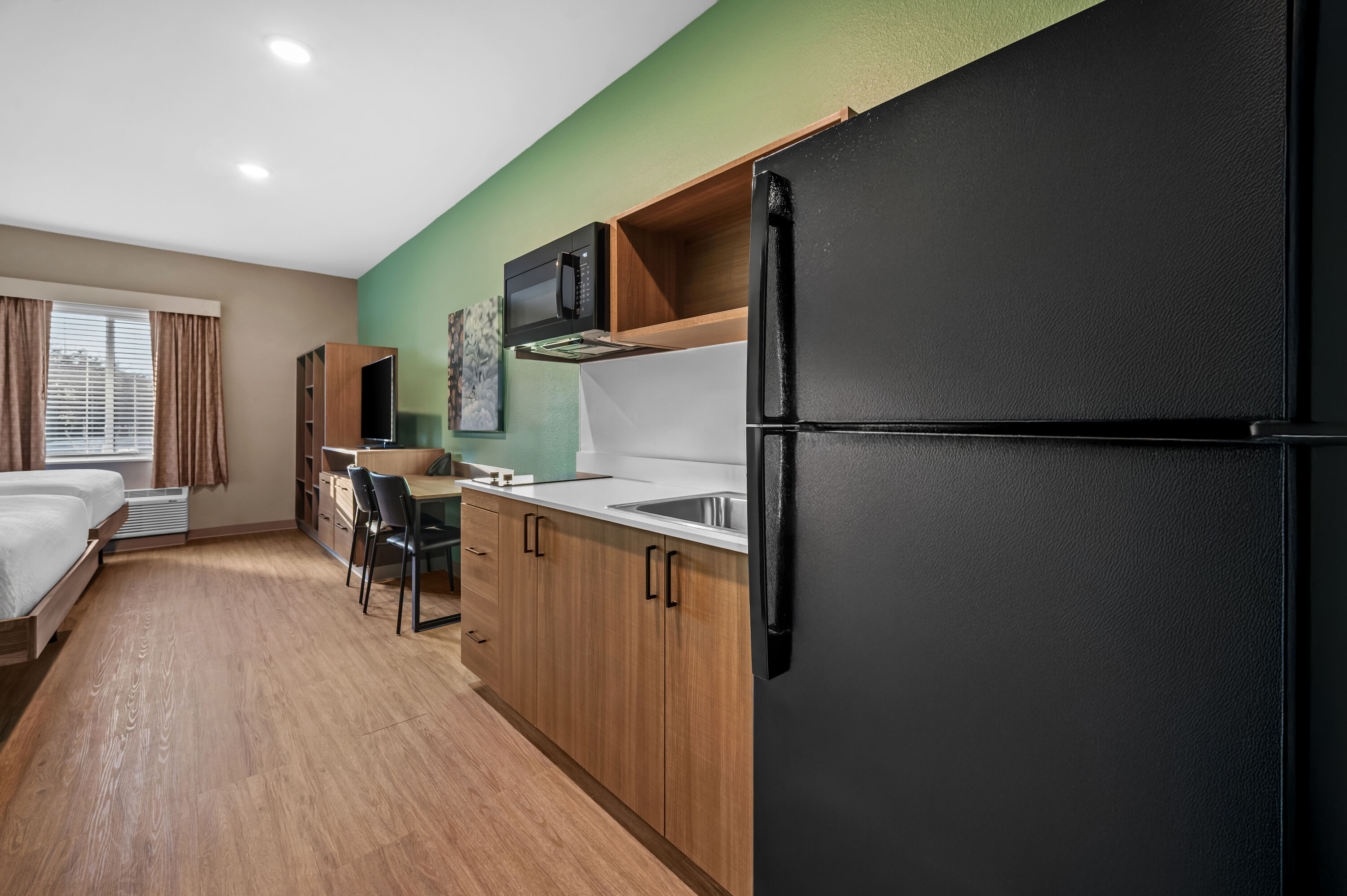 Double bed guest room at the ECHO Suites Extended Stay by Wyndham Naples in Naples, Florida