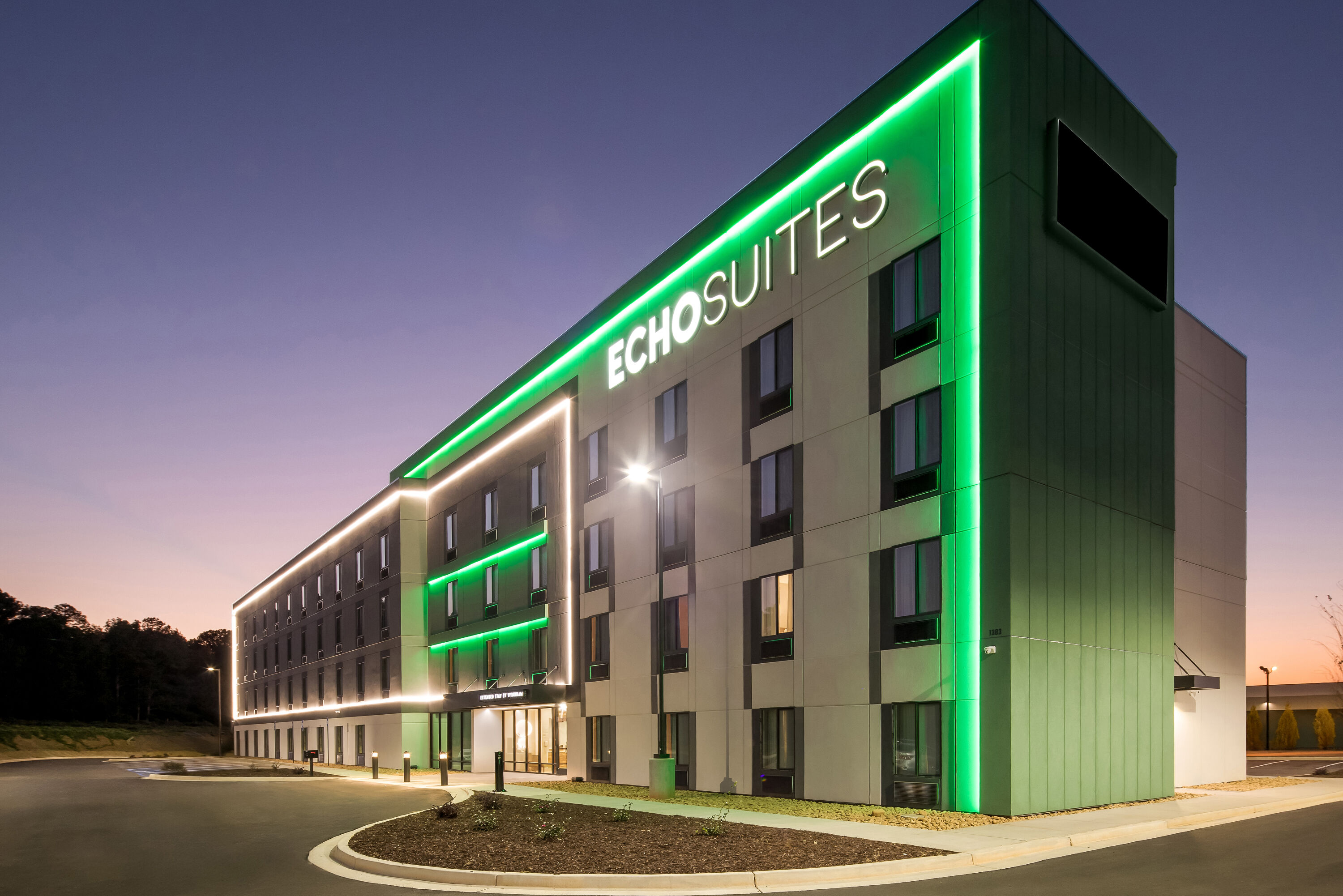 Exterior Night Image of ECHO Suites Extended Stay by Wyndham Conyers hotel in Conyers, Georgia