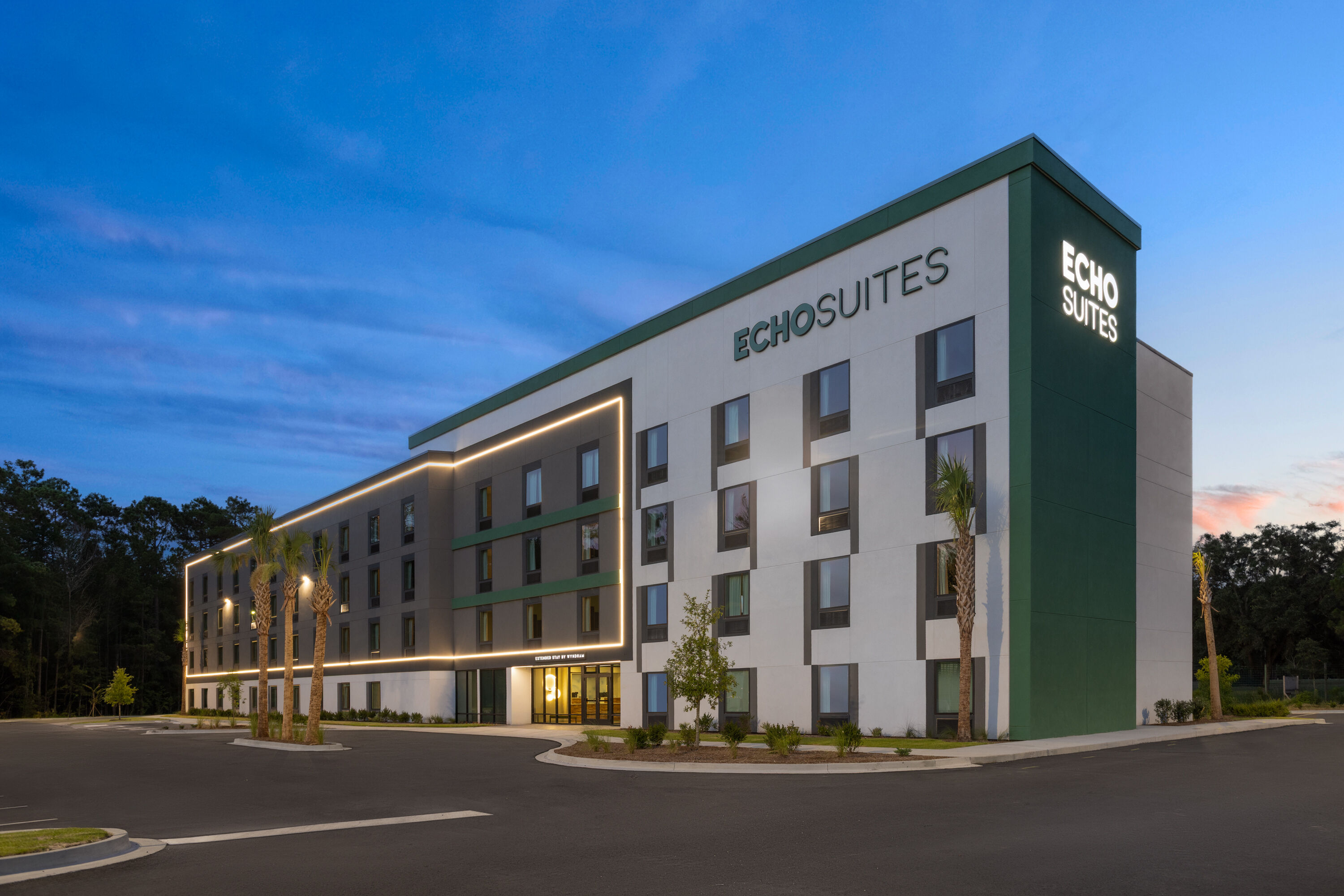 Exterior Dusk Image of ECHO Suites Extended Stay by Wyndham Savannah Pooler hotel in Savannah, Georgia