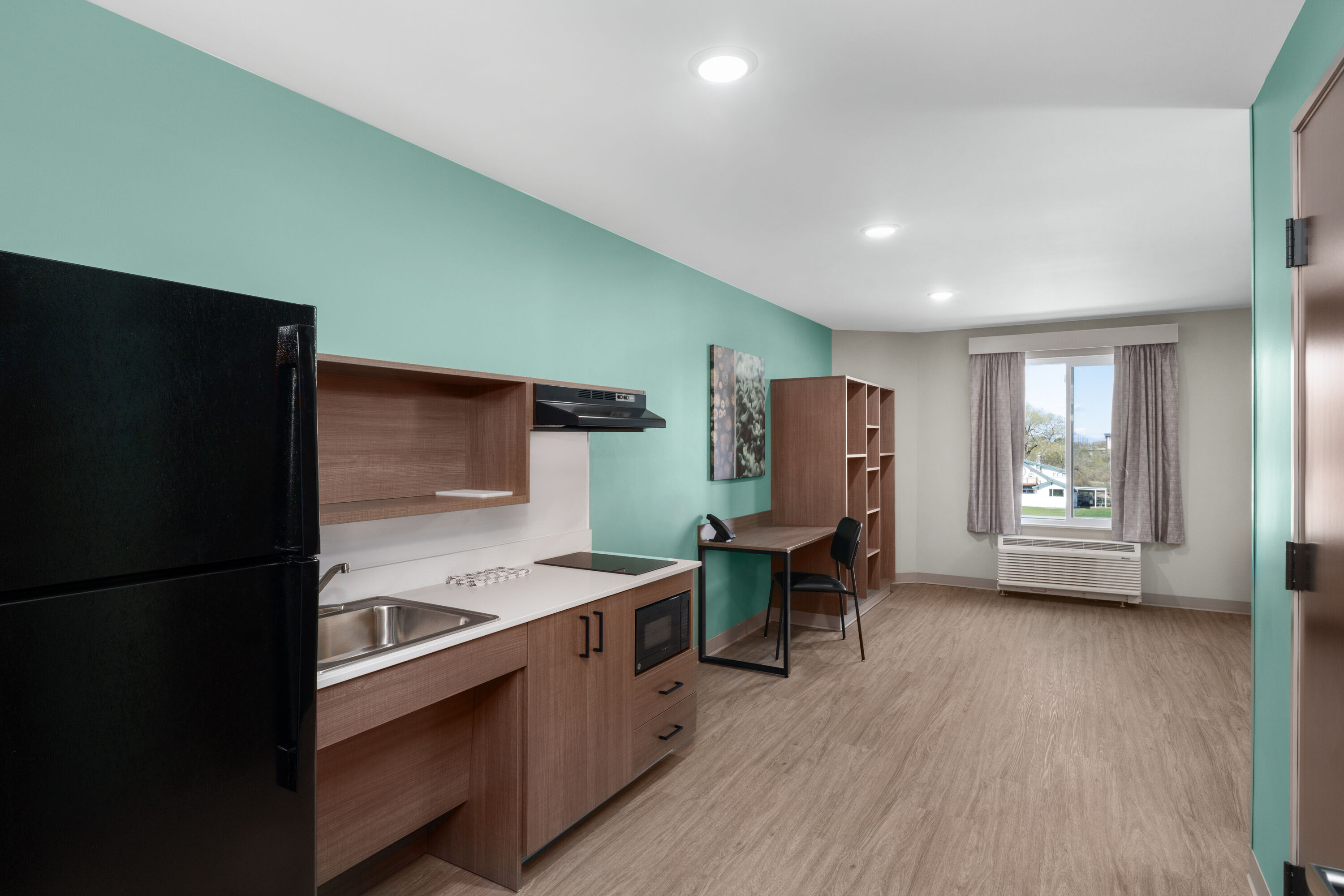Guest room at the ECHO Suites Extended Stay by Wyndham Bozeman in Bozeman, Montana