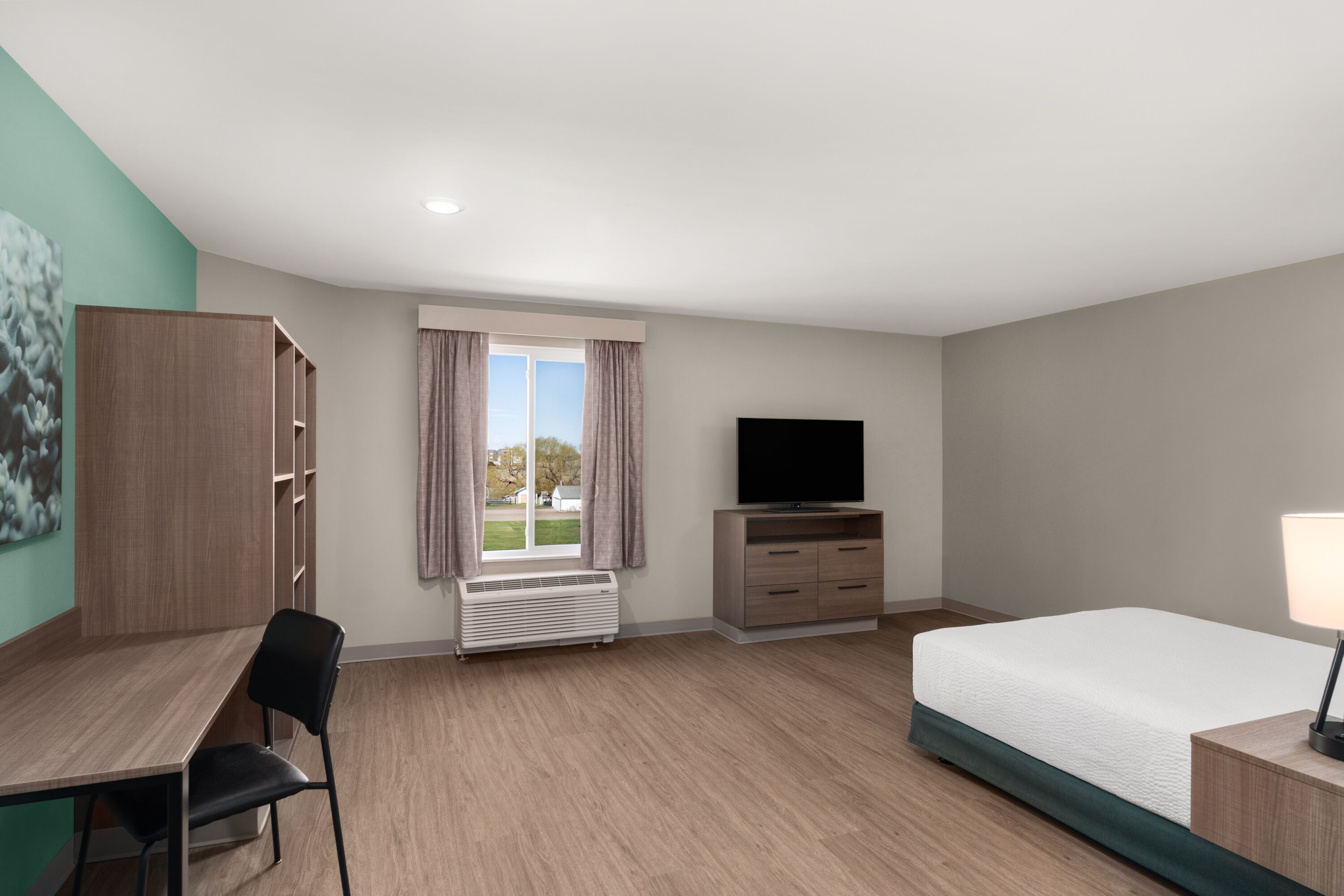 Guest room at the ECHO Suites Extended Stay by Wyndham Bozeman in Bozeman, Montana