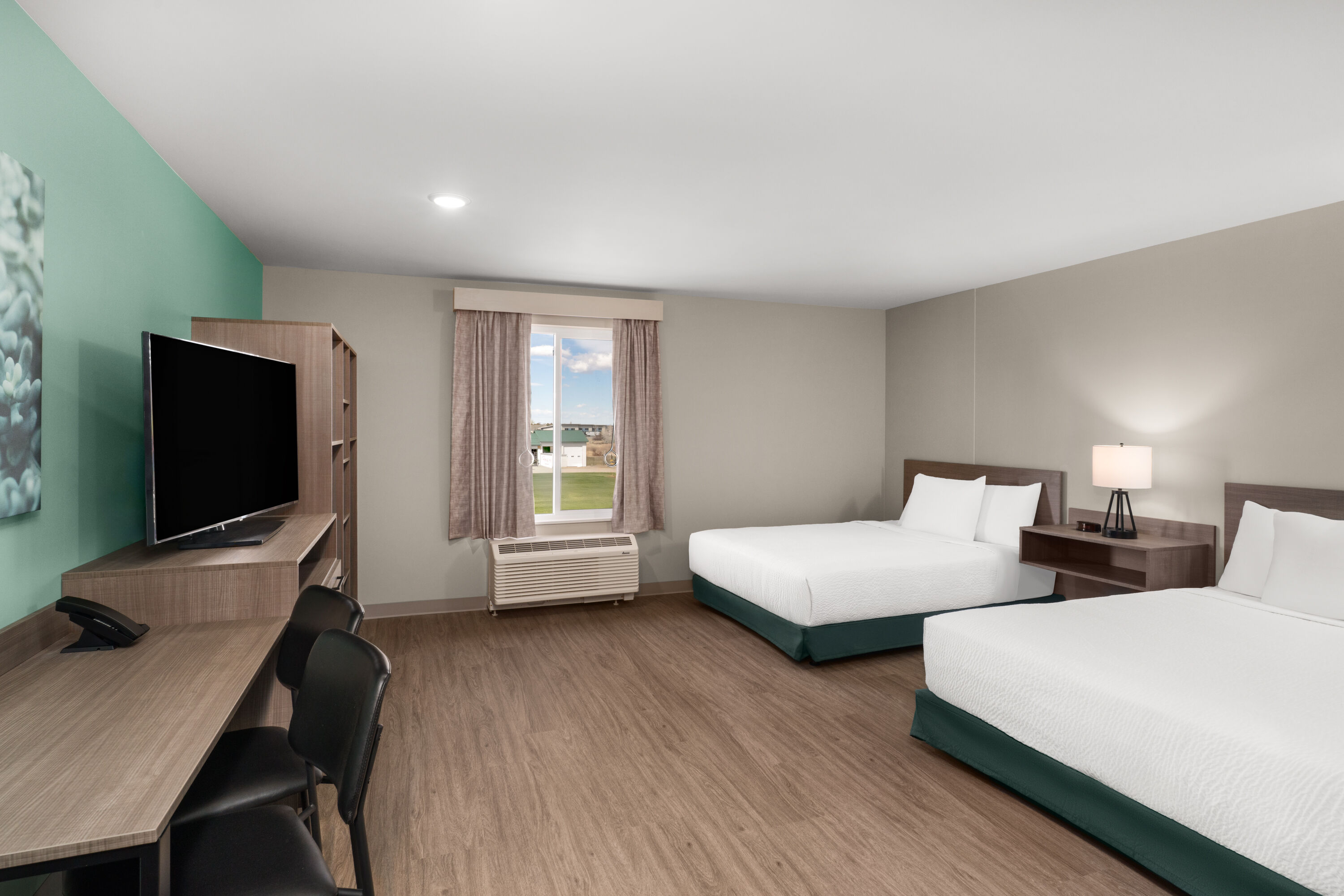 Guest room at the ECHO Suites Extended Stay by Wyndham Bozeman in Bozeman, Montana