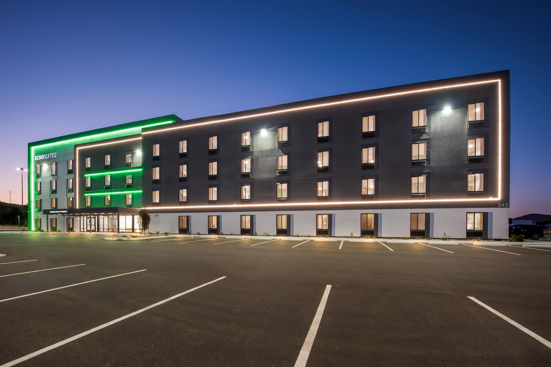 Exterior Night Image of ECHO Suites Extended Stay by Wyndham Reno hotel in Reno, Nevada