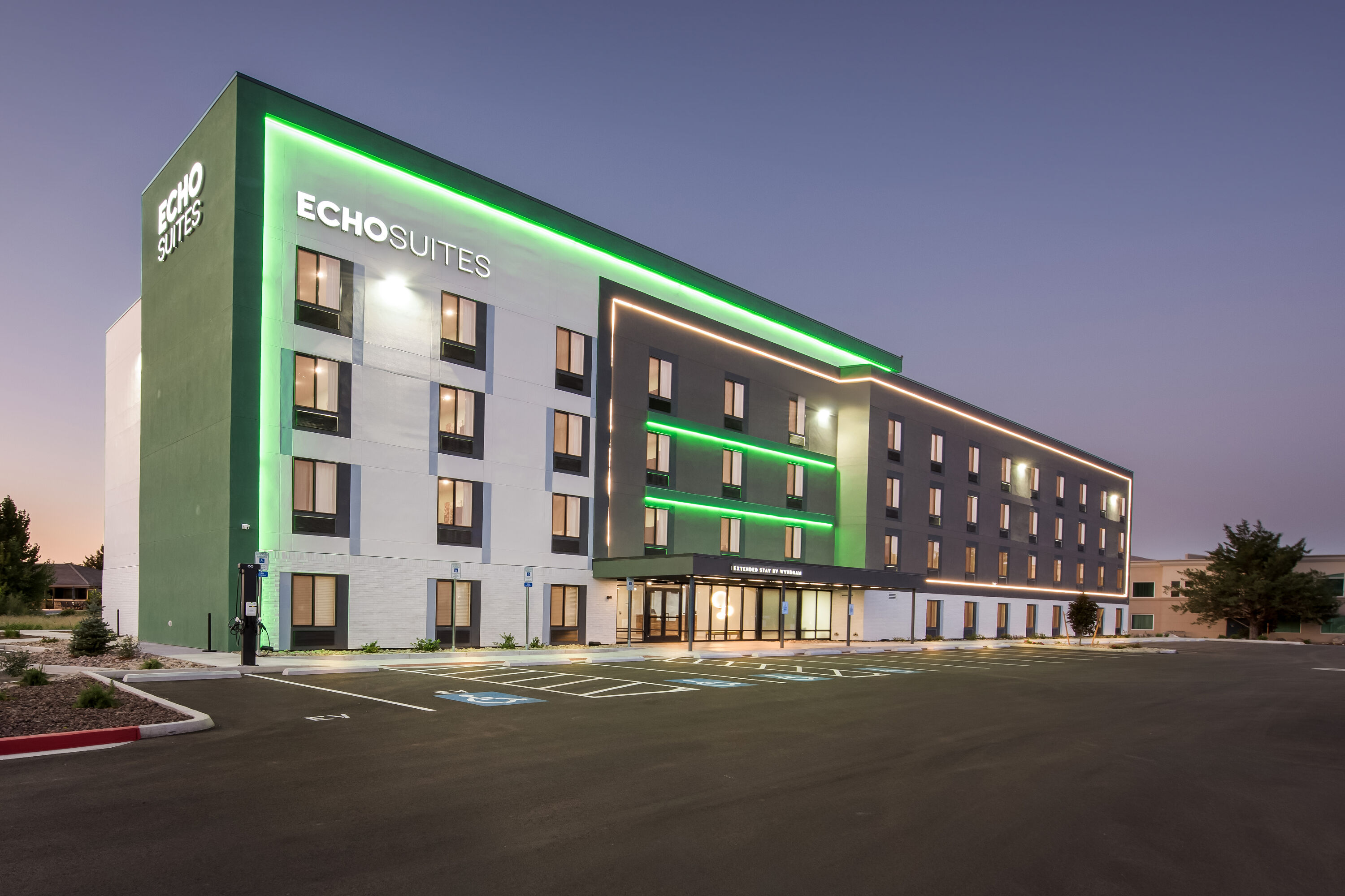 Exterior Night Image of ECHO Suites Extended Stay by Wyndham Reno hotel in Reno, Nevada